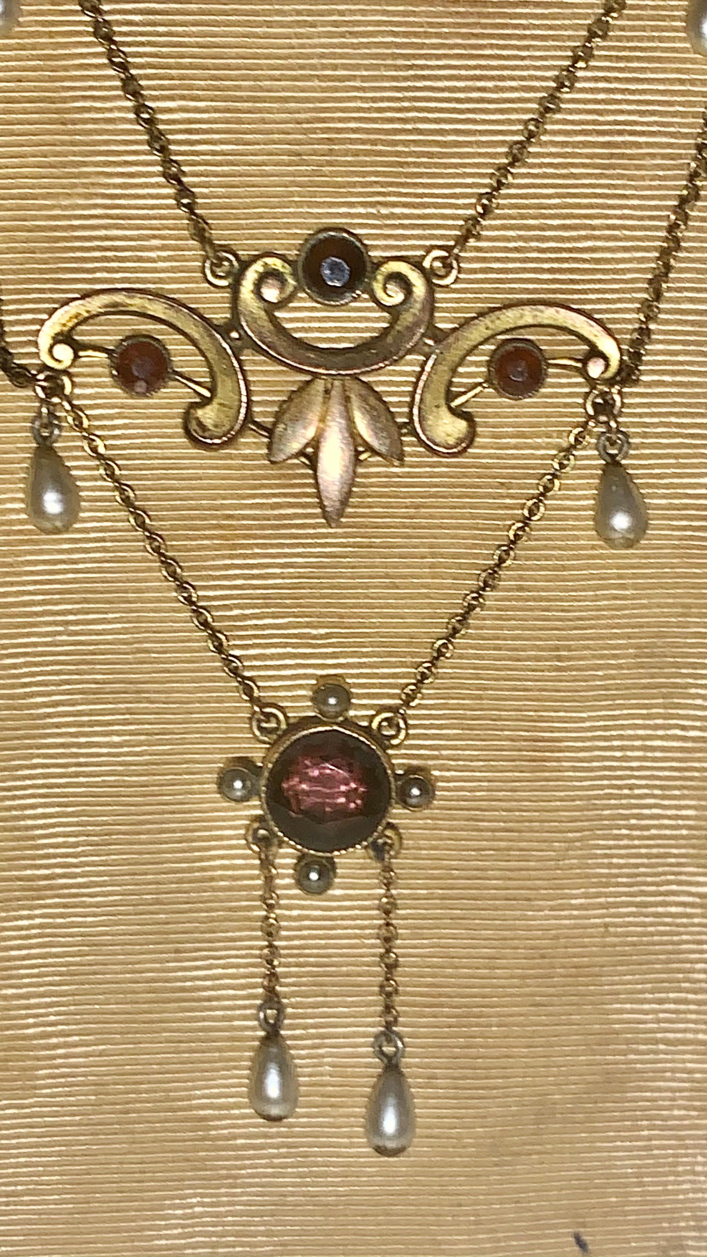 This superb Victorian Amethyst and pearl gold necklace was handcrafted in England around 1880. A very interesting design with six moving pearl dangles. A large Amethyst Centre stone weighing 1.6 carats and the others weigh 0.60 carats total.
The
