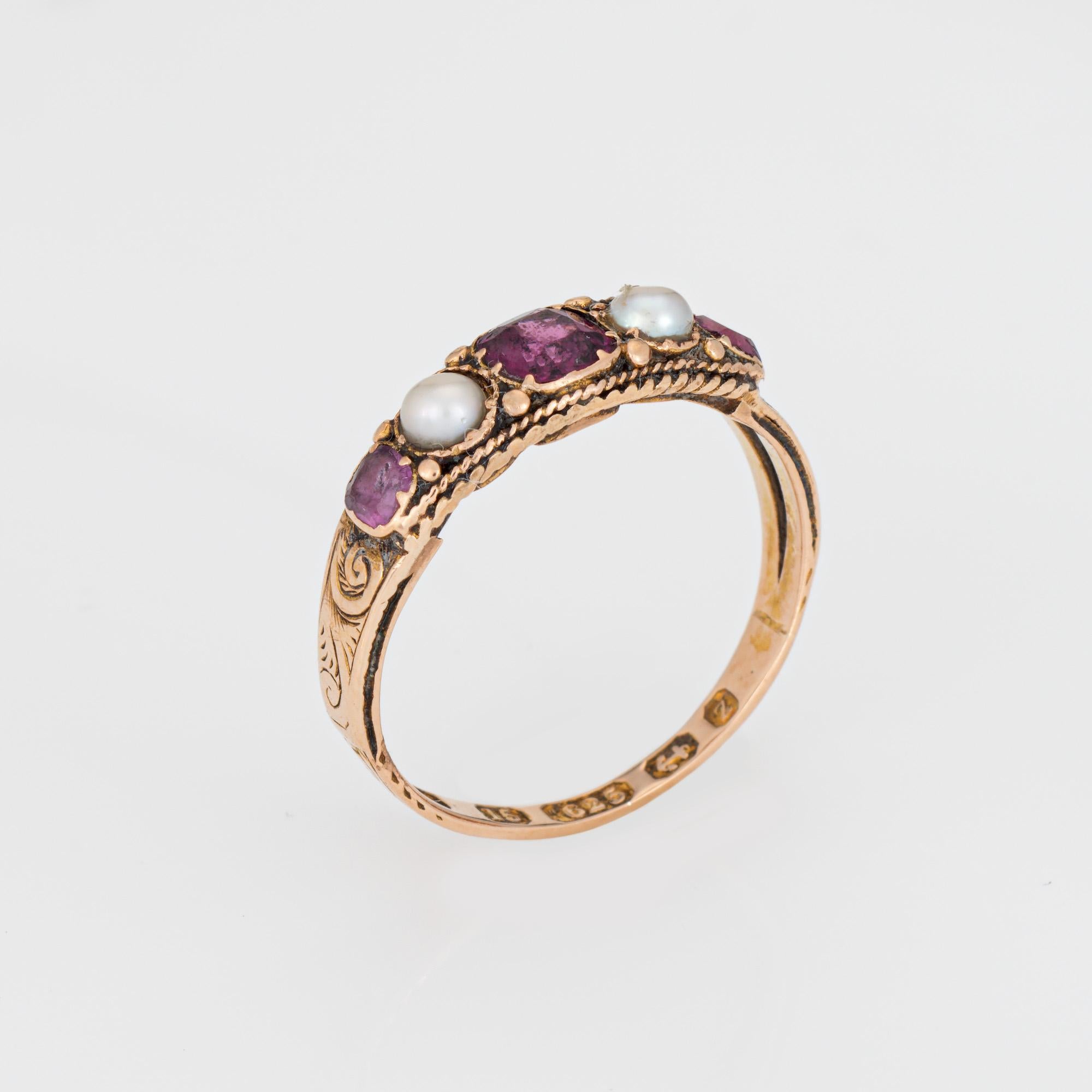 Finely detailed antique Victorian era almandine garnet & pearl ring (circa 1848s), crafted in 15 karat rose gold.

Almandine garnets range in size from 3mm to 4mm. Two pearls measure 3mm each (one pearl is a later replacement).

The charming