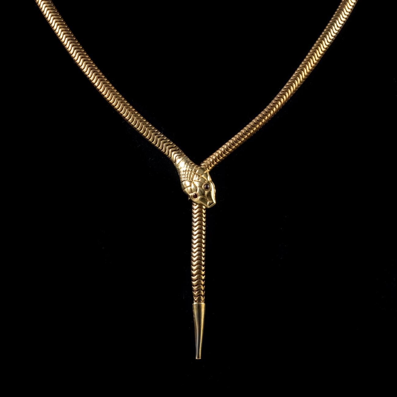 This fantastic Antique Victorian necklace has been commissioned in Silver and gilded with 18ct Yellow Gold. It is designed to represent the form of a snake with the head and tail coming together to form a slider clasp. It features articulated links