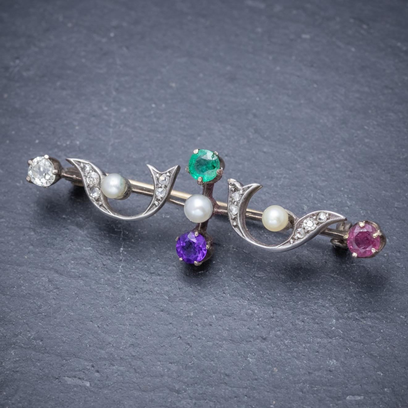A splendid antique Victorian Dearest brooch decorated with Diamonds, Pearls and four gemstones at each end which spell out the word ‘DEAR’ with each first letter – Diamond, Emerald, Amethyst, Ruby. 

The stones are set in a fancy gallery modelled in