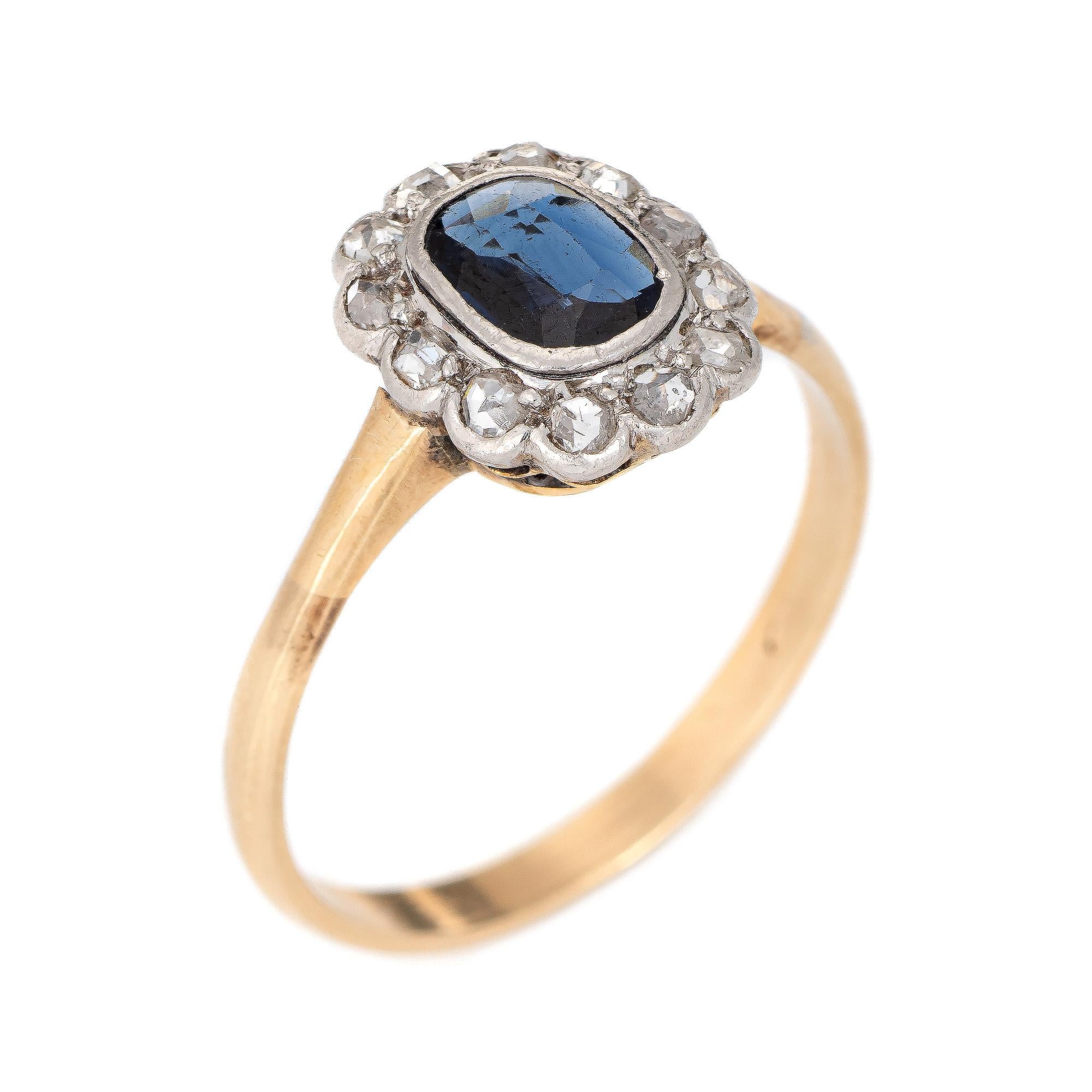 Finely detailed handmade antique Victorian gemstone engagement ring (circa 1890s) crafted in 14 karat yellow gold and platinum. 

One cushion shaped mixed cut natural sapphire, approx. 0.60ct (6.80 x 5.30 x 1.77mm), dark blue color, lightly