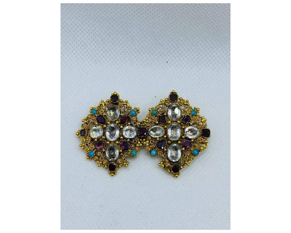 A Antique Victorian Gemstone Garnet Sapphire Gold Brooch 
features two matching colorless sapphire, garnet and turquoise 
CONDITION 
some minor wear Consistent with age and use please see the photos for condition 
size is approximately 2 ½ inches