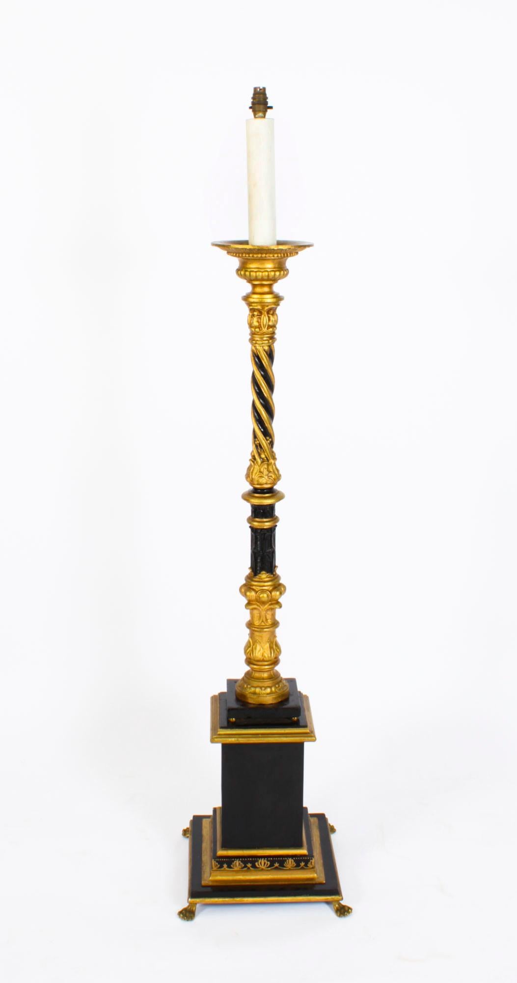 This is a highly attractive antique classical column design ormolu floor standard lamp now converted to electricity, circa 1890 in date.
 
This splendid lamp features a distinguished cylindrical ebonised and gilded spiral reeded column rising from