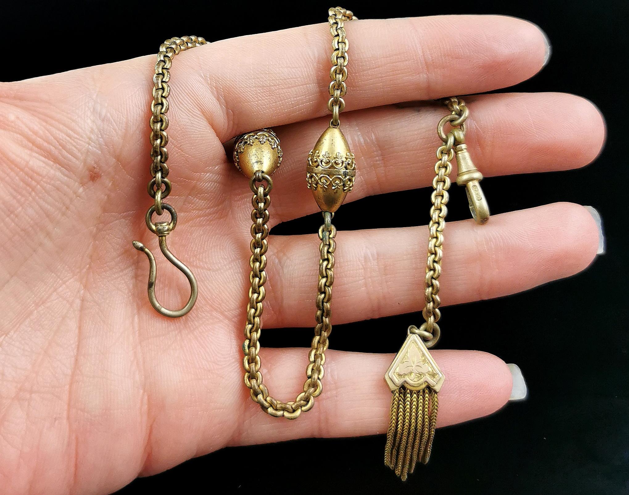 A pretty antique Victorian era gilt albertina chain.

Perfect for displaying your favourite fob watch or utilising as a bracelet.

It is made from gilt metal and has a rolo link chain intercepted with large fancy gilt beads, each bead with applied