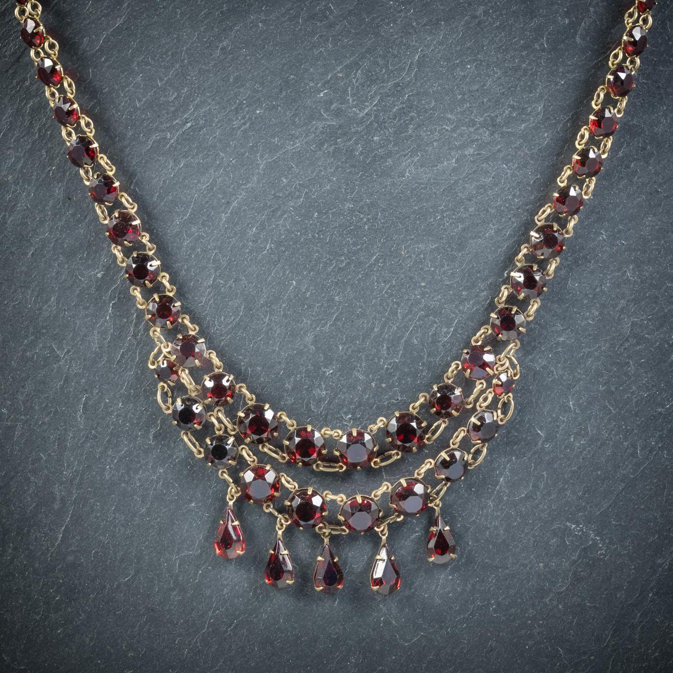 A grand antique Riviere necklace from the Victorian era, Circa 1900

The fabulous piece is decorated throughout with deep red Glass stones that resemble Garnets, graduating in size to five beautiful glass droppers

All set in Base Metal displaying