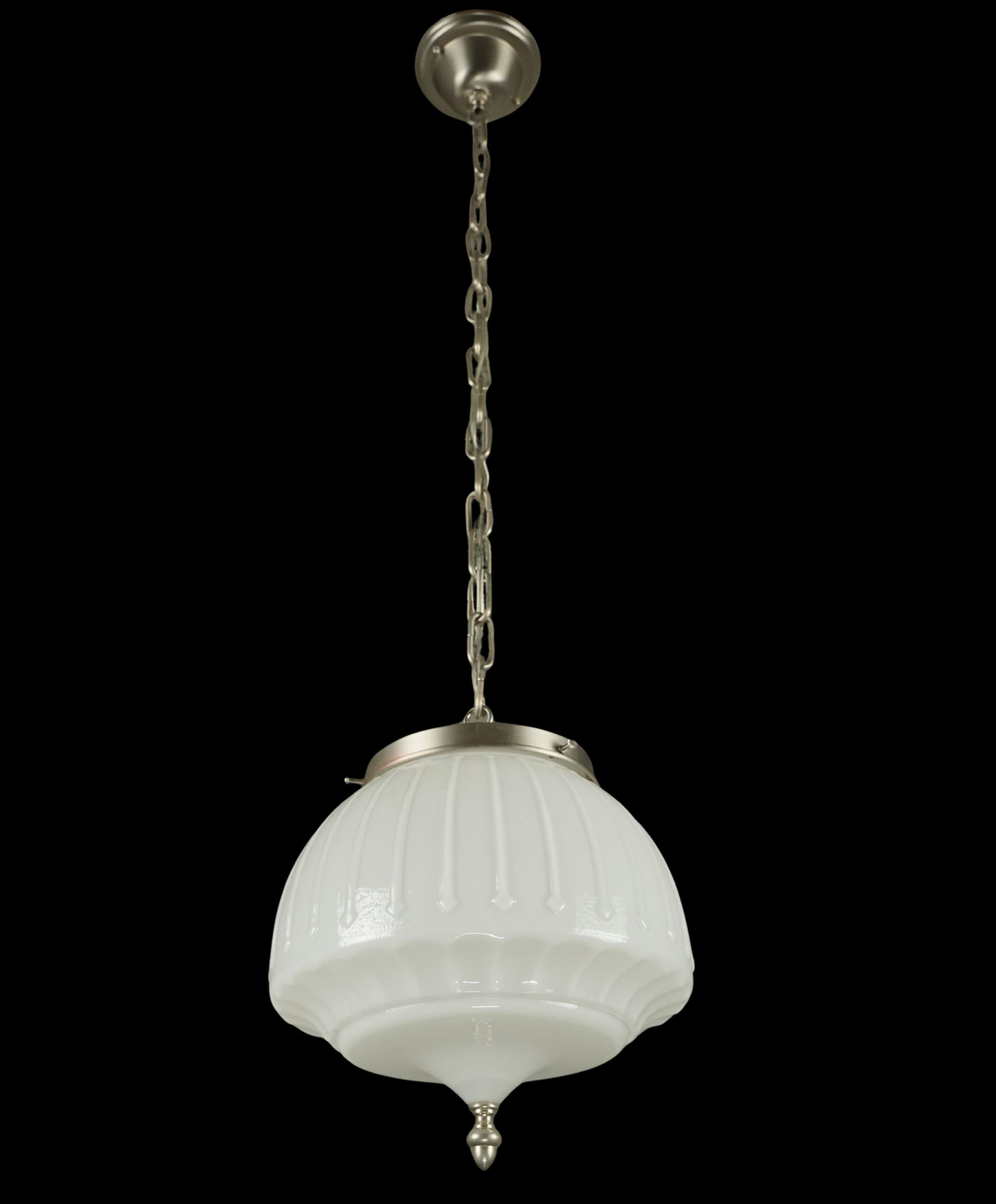 Victorian style pendant light featuring a fluted white glass globe, a nickel acorn finial, and a nickel plated steel chain fitter. This requires one standard Edison style medium base bulb. Cleaned and restored. Good condition with surface wear from