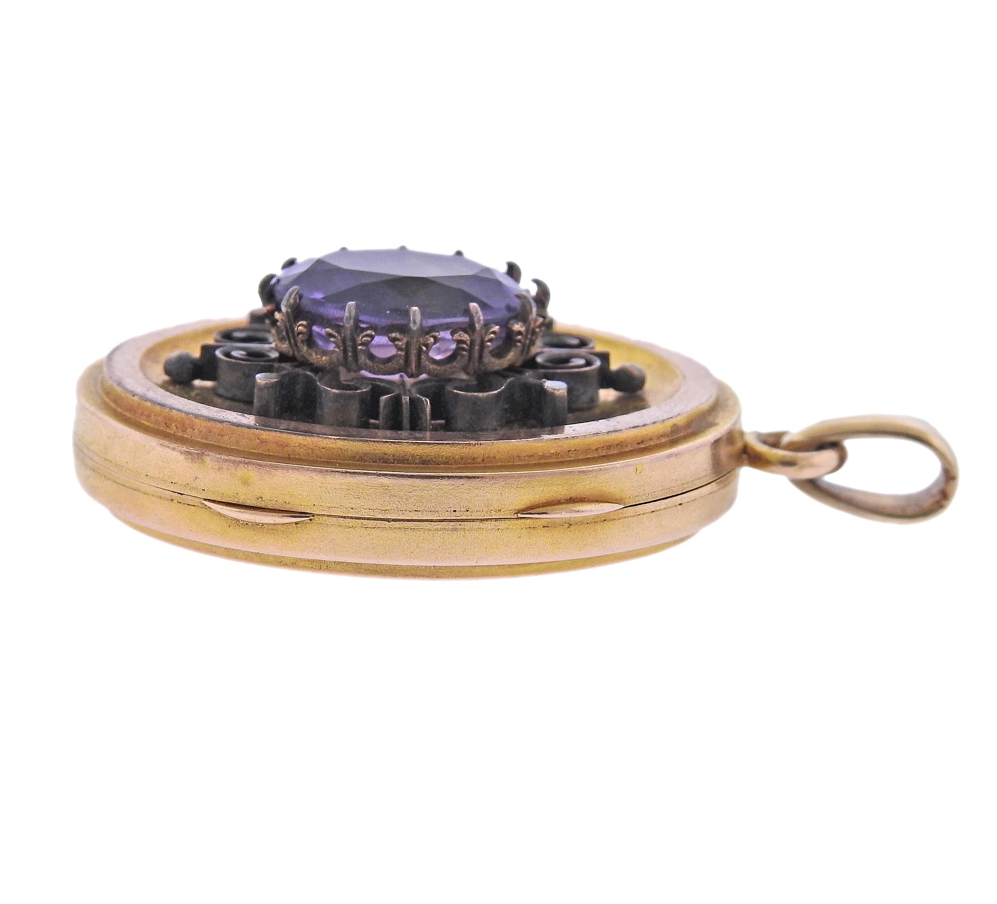 Antique Victorian 14k gold locket pendant, with center oval amethyst. Pendant is  47mm x 27mm, tarnish on pendant is present.  weight - 18 grams.