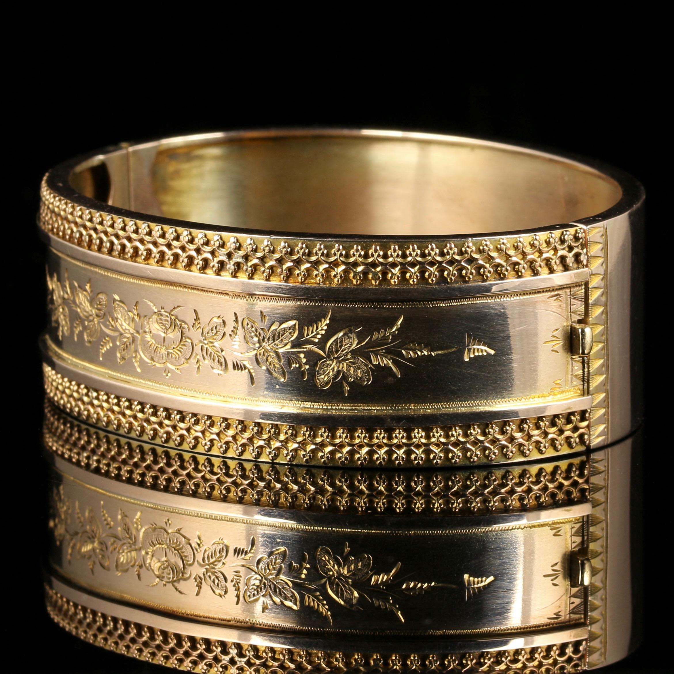 For more details please click continue reading down below...

This lovely antique Victorian fancy bangle is beautiful, Circa 1880.

Set in 9ct Yellow Gold.

The front of the bangle is inlaid with a Gold floral gallery surrounded by fabulous