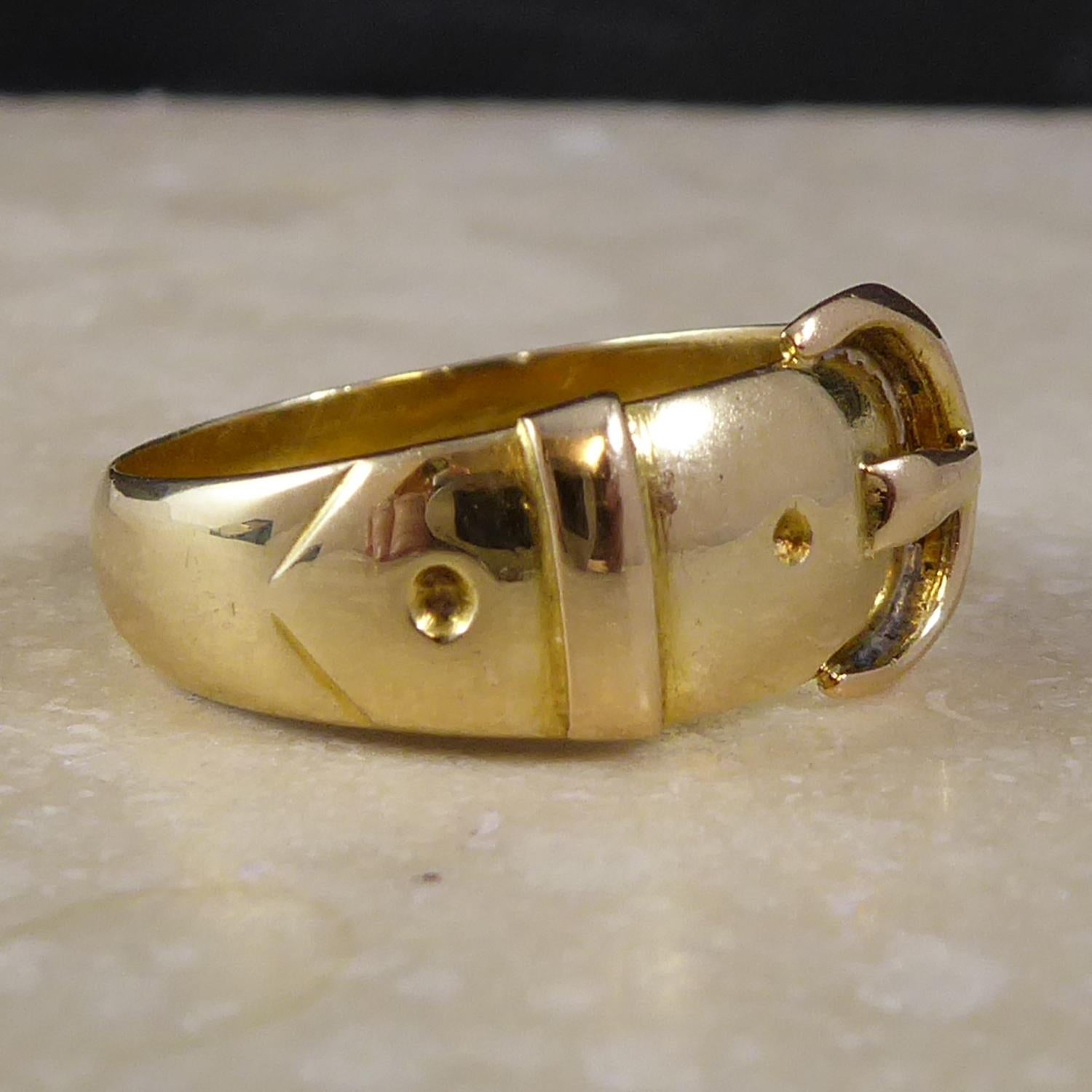 A beautiful antique ring crafted in 18ct yellow gold.  The ring is designed in the form of a buckled belt, a popular motif in Victorian jewellery.  Hallmarked at the Birmingham Assay Office in 1896, the hallmarked having been stamped beneath the