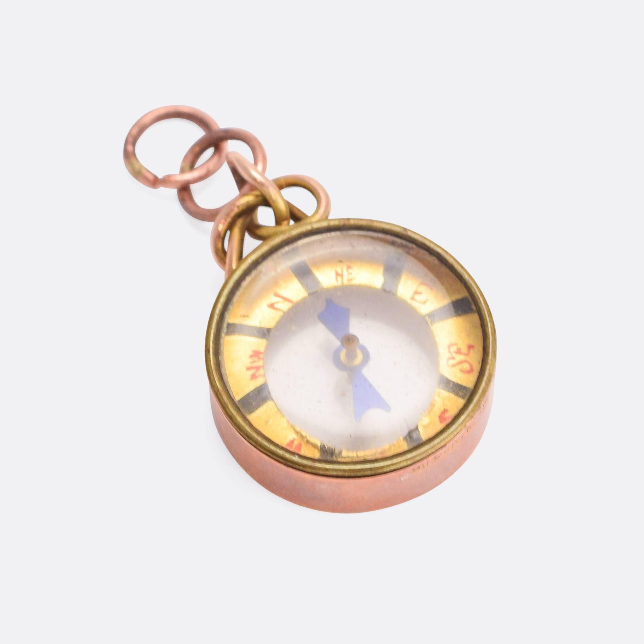 A fine antique compass pendant modelled in 9 karat rose gold. With original glass and fittings, with hand painted compass points and detailing. 

MEASUREMENTS 
2.3 x 1.6cm

WEIGHT 
3.4g

MARKS 
English hallmarks for 9k gold, Chester 1898