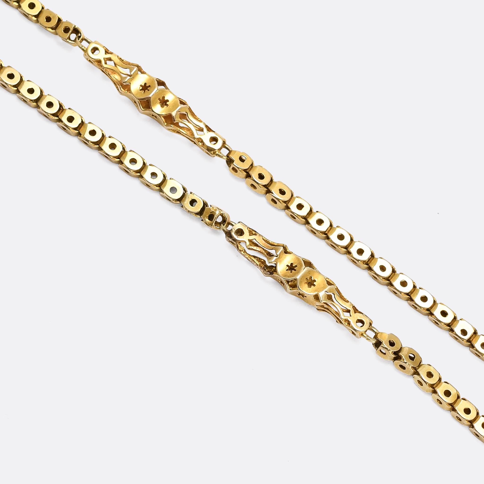 A beautifully made fancy link 46 inch guard chain dating from the late Victorian period, circa 1890. It's modelled in 9 karat gold throughout, and comprises box links and longer, pierced divider sections - all finely handmade and remaining in great
