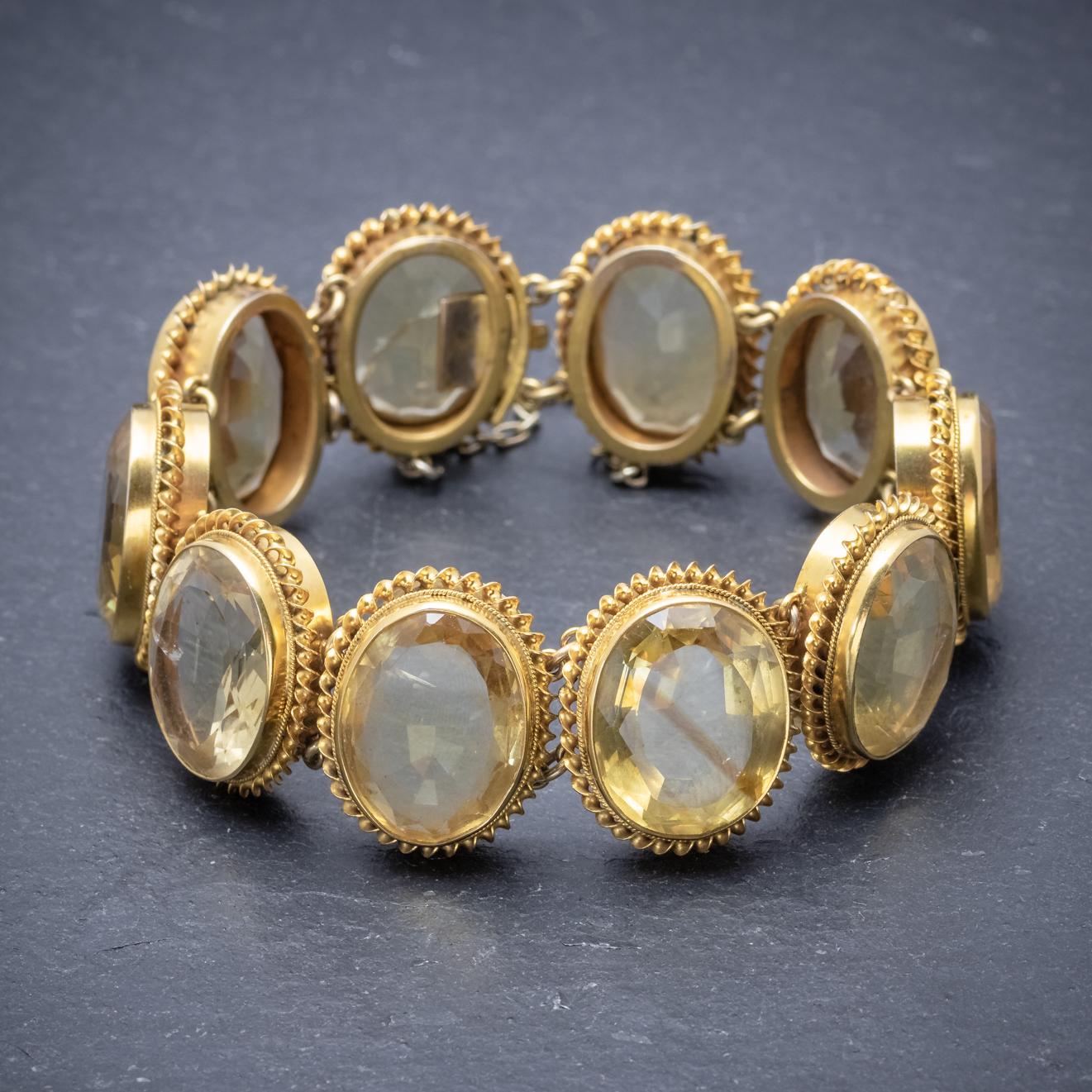 This beautiful antique Victorian bracelet is adorned with ten bright Citrines which glow with a lovely golden hue around the entire piece. Each stone is around 10ct, approx. 100ct in total. 

The stones are set in fancy Golden frames which are