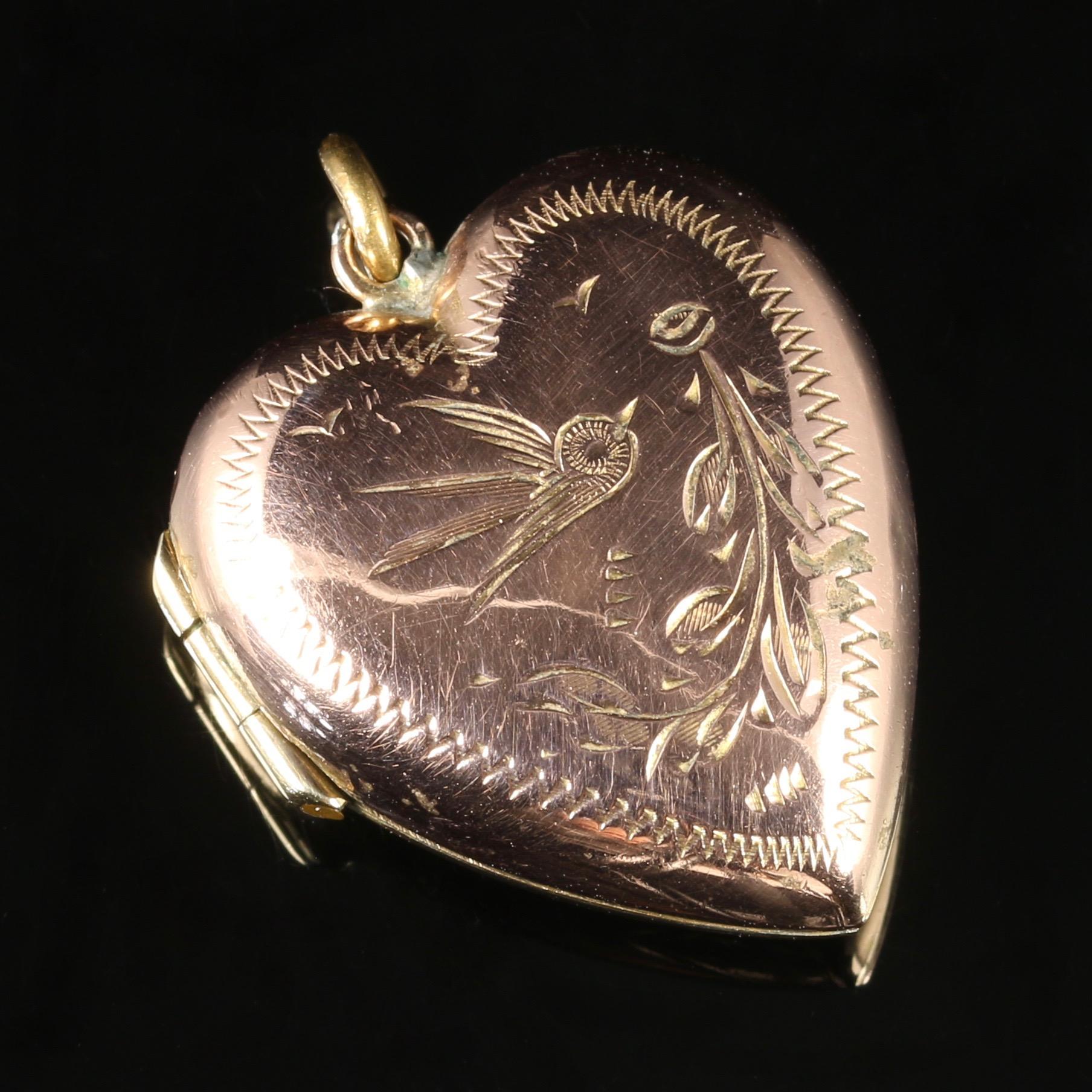 For more details please click continue reading down below...

This fabulous antique Victorian heart locket is set in 9ct Gold, Circa 1880.

The front of the locket has a Rose gold hue which has developed with age, and is beautifully engraved with