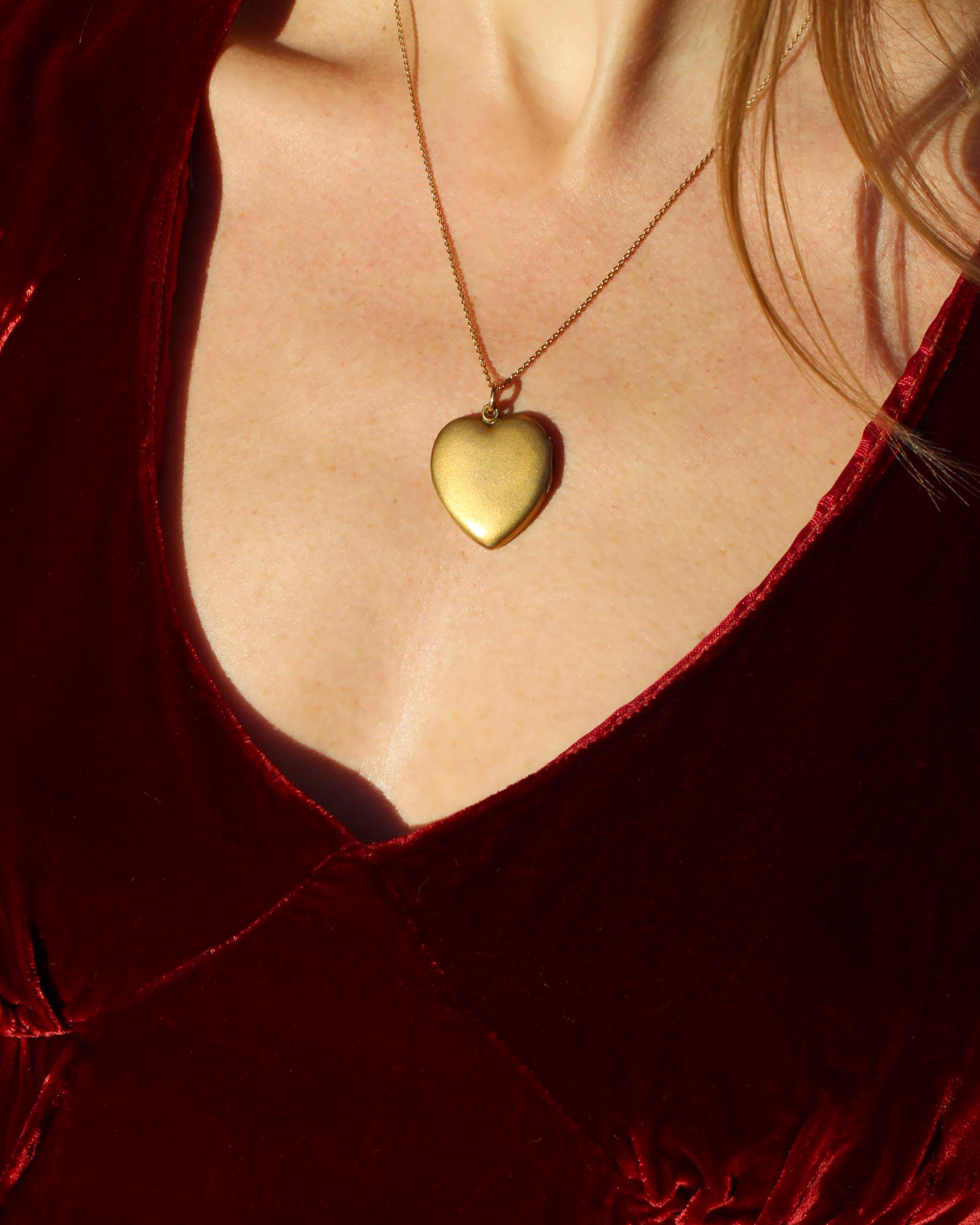 Circa 19th Century, this heart locket dates back to the Victorian era. It is so romantic and makes the perfect gift. The locket opens with hinges, and can carry a memento inside. One side is monogrammed, the other side is not engraved, and you could