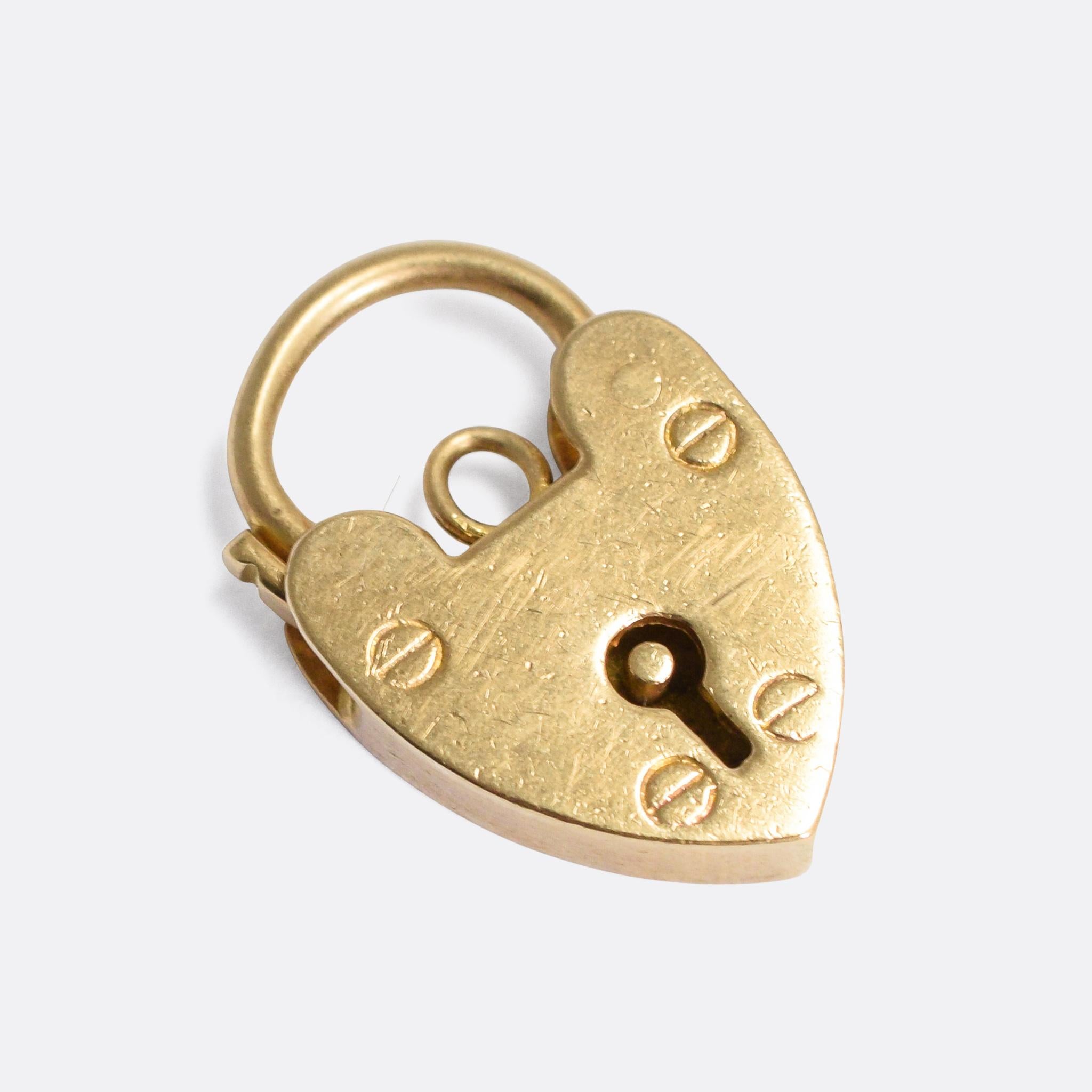 A sweet antique heart padlock dating from the turn of the 20th Century. It would likely have been created as a bracelet clasp, but looks equally great worn as a pendant or as part of a charm collection.

MEASUREMENTS 
1.8 x 1.2cm

WEIGHT