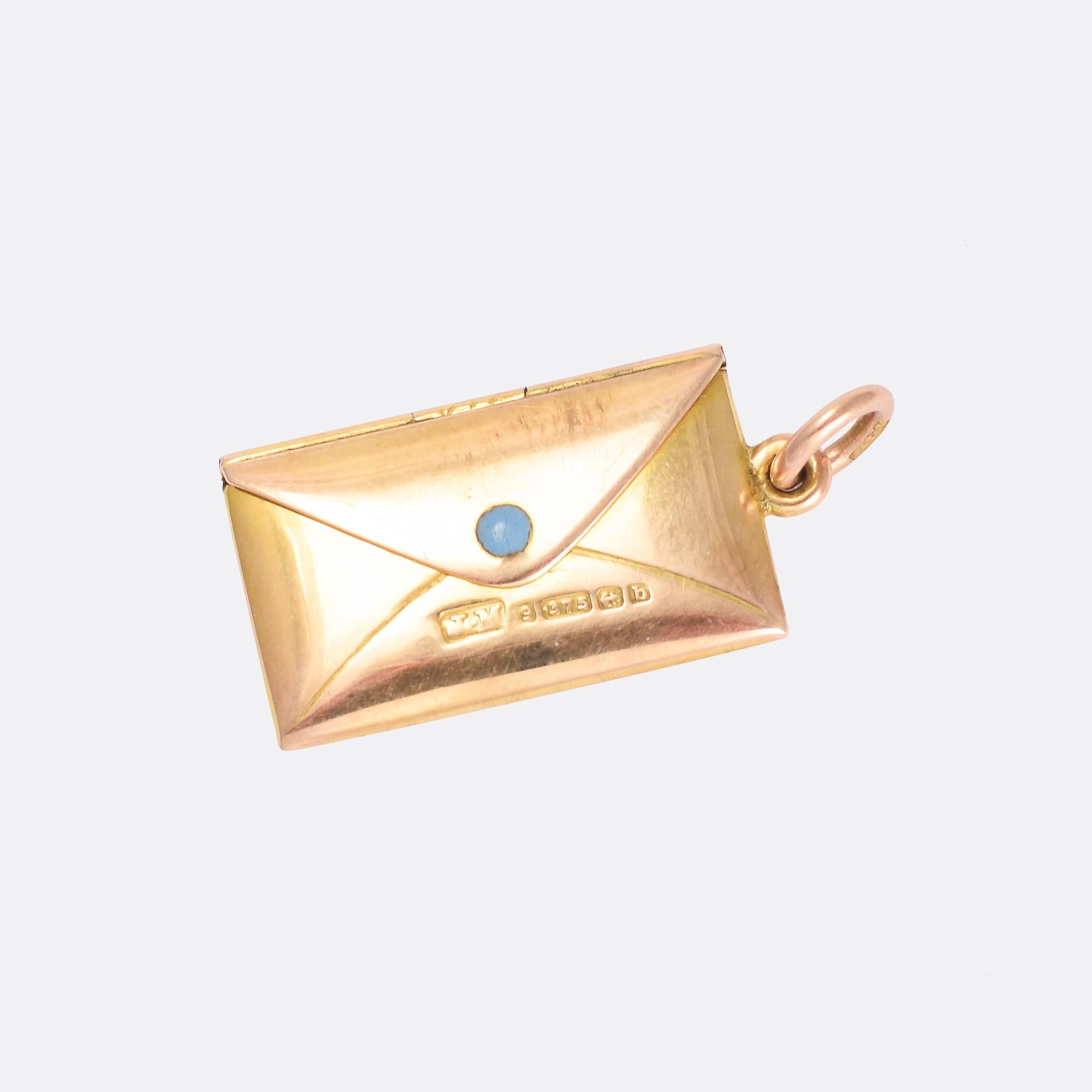 Such a sweet antique locket modelled as an envelope with the name Bobby engraved onto the front. It opens up to reveal a letter with the words I LOVE YOU on one side, and signed John on the back. It's crafted in 9 karat gold and set with a single