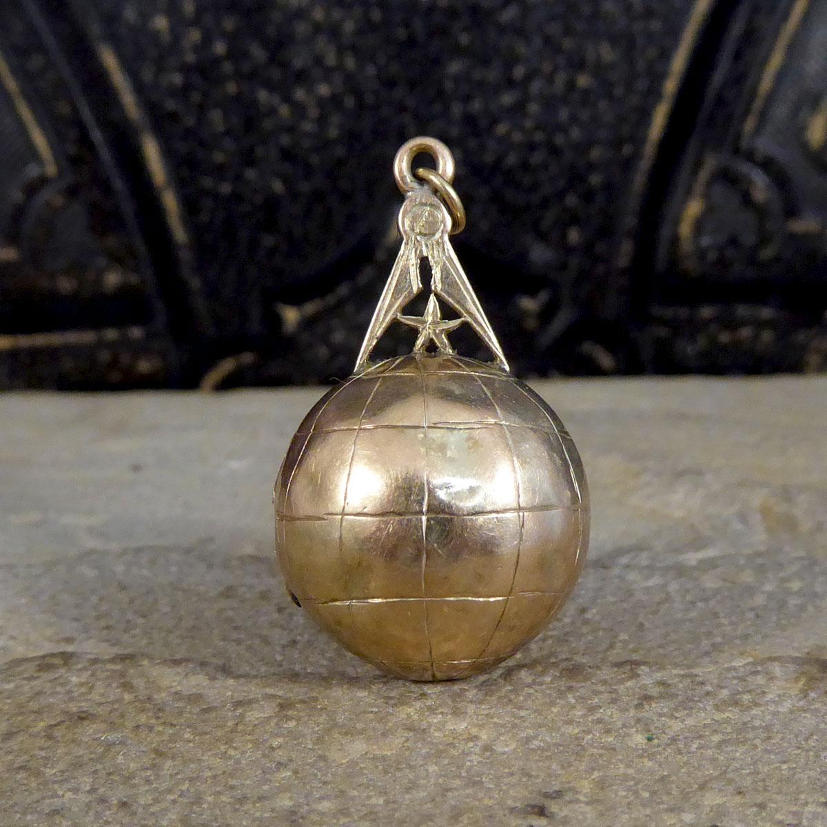 This wonderful masonic fob pendant was hand crafted in Victorian England and is very unique to see in this style. It shows a compass and star on top a globe which opens to reveal a star insider and the folding out of the symbols themselves ending