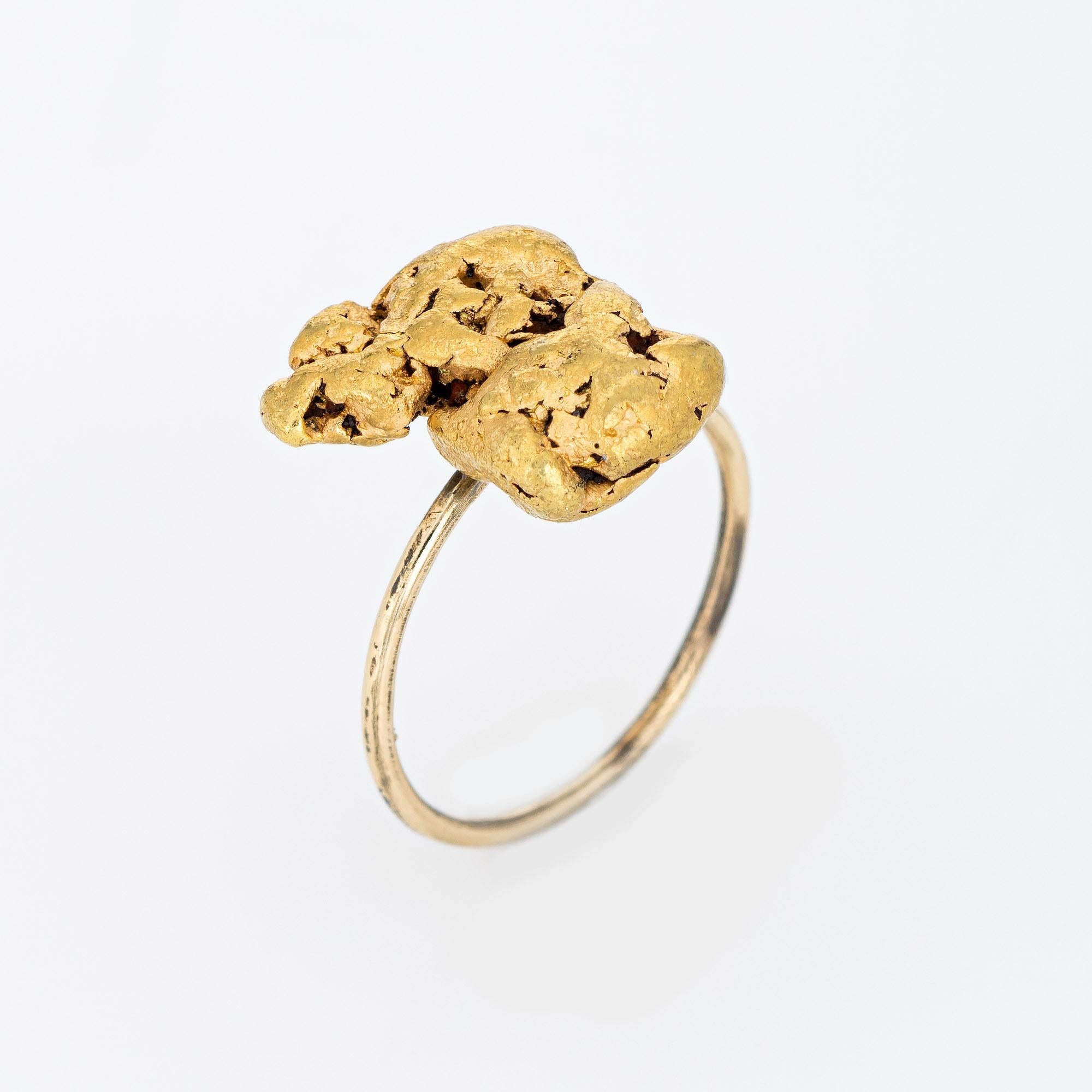 Originally an antique Victorian era stick pin (circa 1880s to 1900s), the natural gold nugget is crafted in 14 karat yellow gold.

The ring is mounted with the original stick pin. Our jeweler rounded the stick pin into a slim band for the finger.