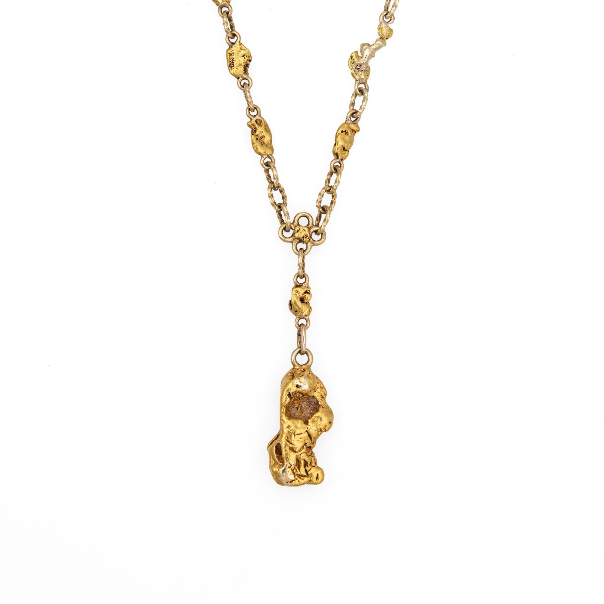 Finely detailed antique Victorian gold nugget necklace (circa 1880s to 1900s), crafted with a 14 karat yellow gold chain and 22k to 24k natural gold nuggets. 

The bold and distinct Victorian era necklace highlights a beautiful display of 26 natural