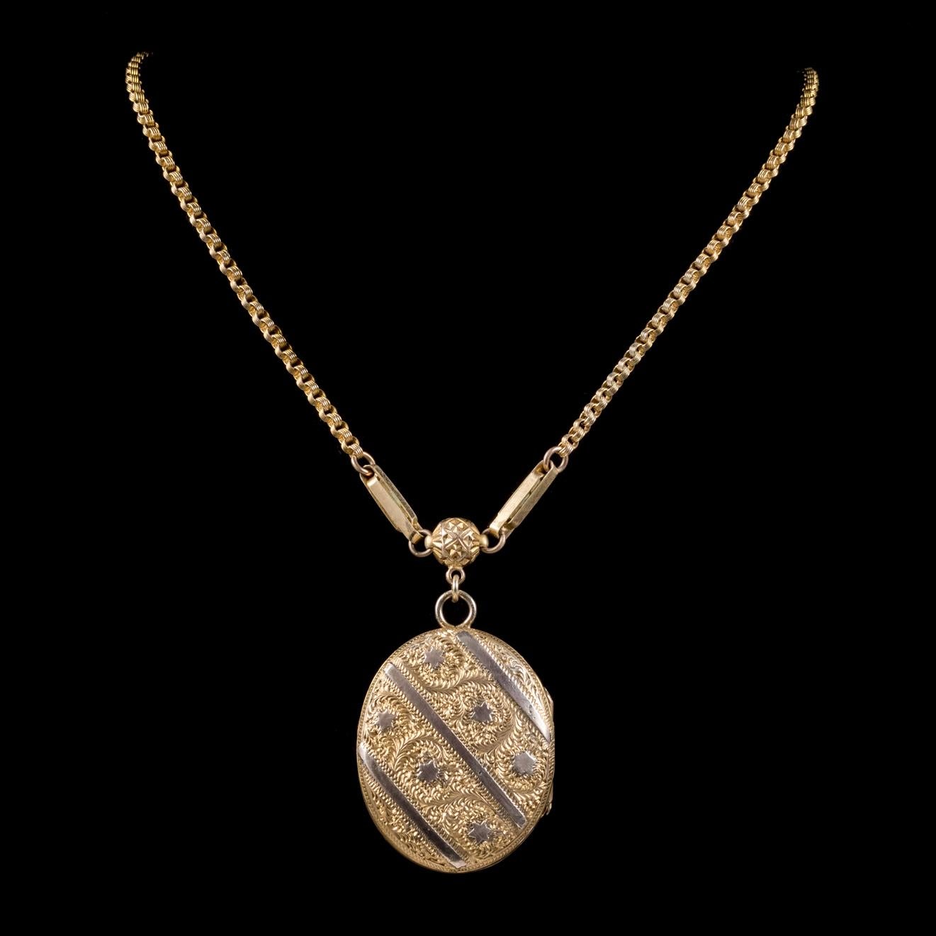 A beautiful antique Victorian necklace C. 1900, featuring a fabulous Locket engraved with Stars and detailed leaves across the front. 

The inside of the Locket is complete with a rim and window in which a photograph or lock of hair can be