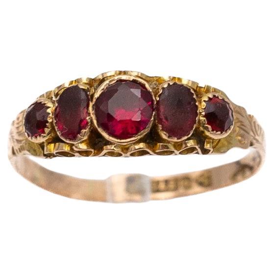 Antique Victorian gold ring with garnets, Great Britain, circa 1915.