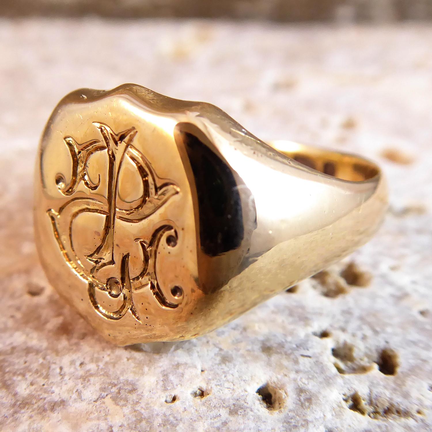 Wonderful antique signet ring with a shield shaped top ornately engraved with the initials J.S. engraved in such a way that the ring would be used as a seal.  the overall maximum measurements of the top of the ring are approx. 0.5