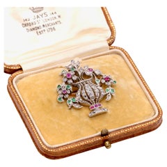 Antiguo broche victoriano de oro y plata con colgante de diamantes, rubíes y esmeraldas Jardiniere