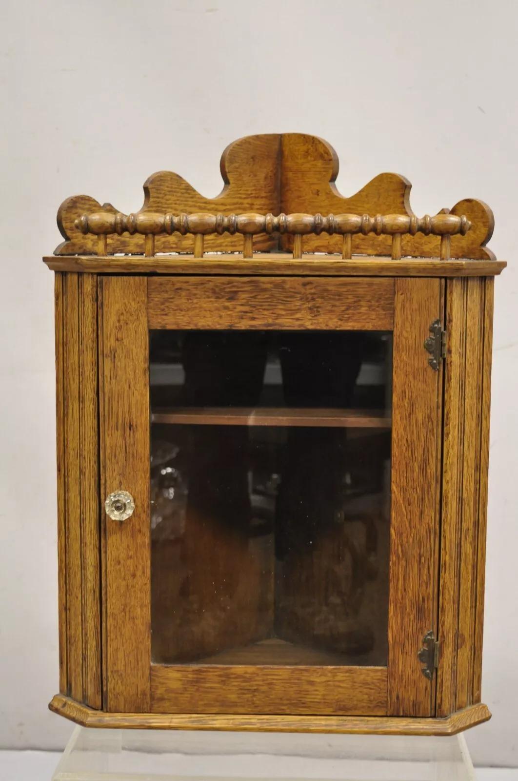 Antique Victorian Golden Oak Wood Glass One Door Small Corner Wall Curio Cabinet. Circa Early 20th Century. Measurements: 24.5