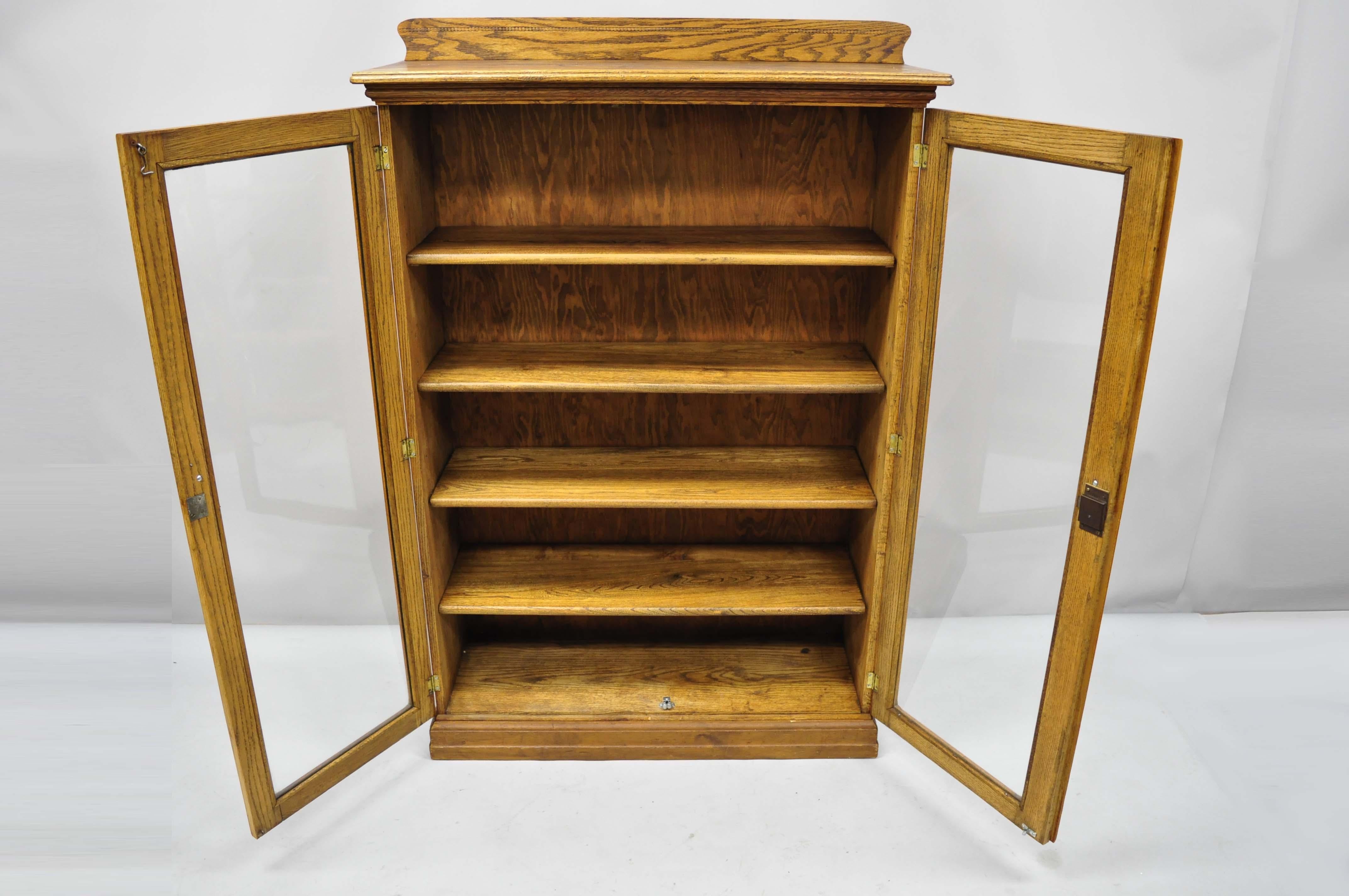 antique oak cabinet with glass doors