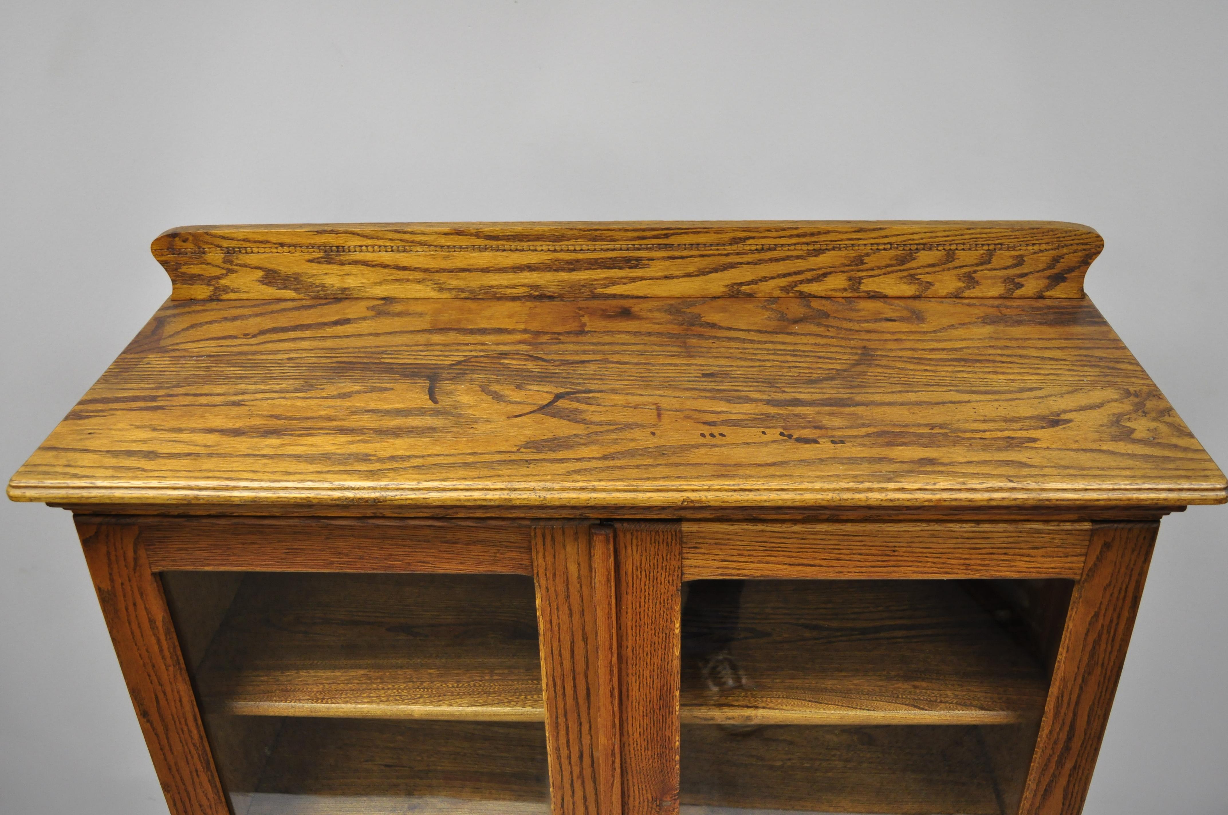 antique oak bookcase with glass doors