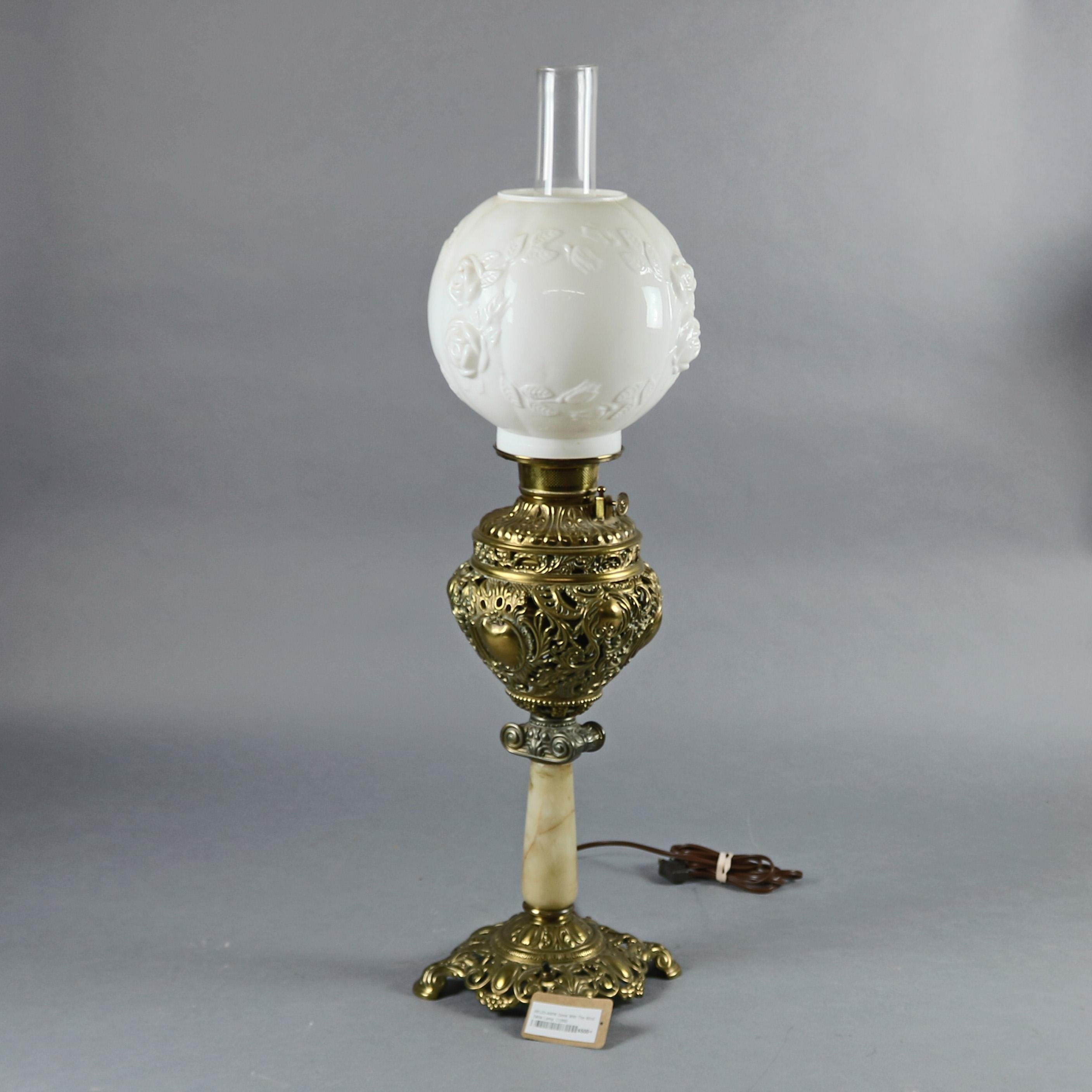 An antique Victorian Gone With The Wind parlor table lamp features base with pierced foliate and scroll brass font and base having marble column and blown out floral shade, electrified and working, c1880

Measures - 31.5