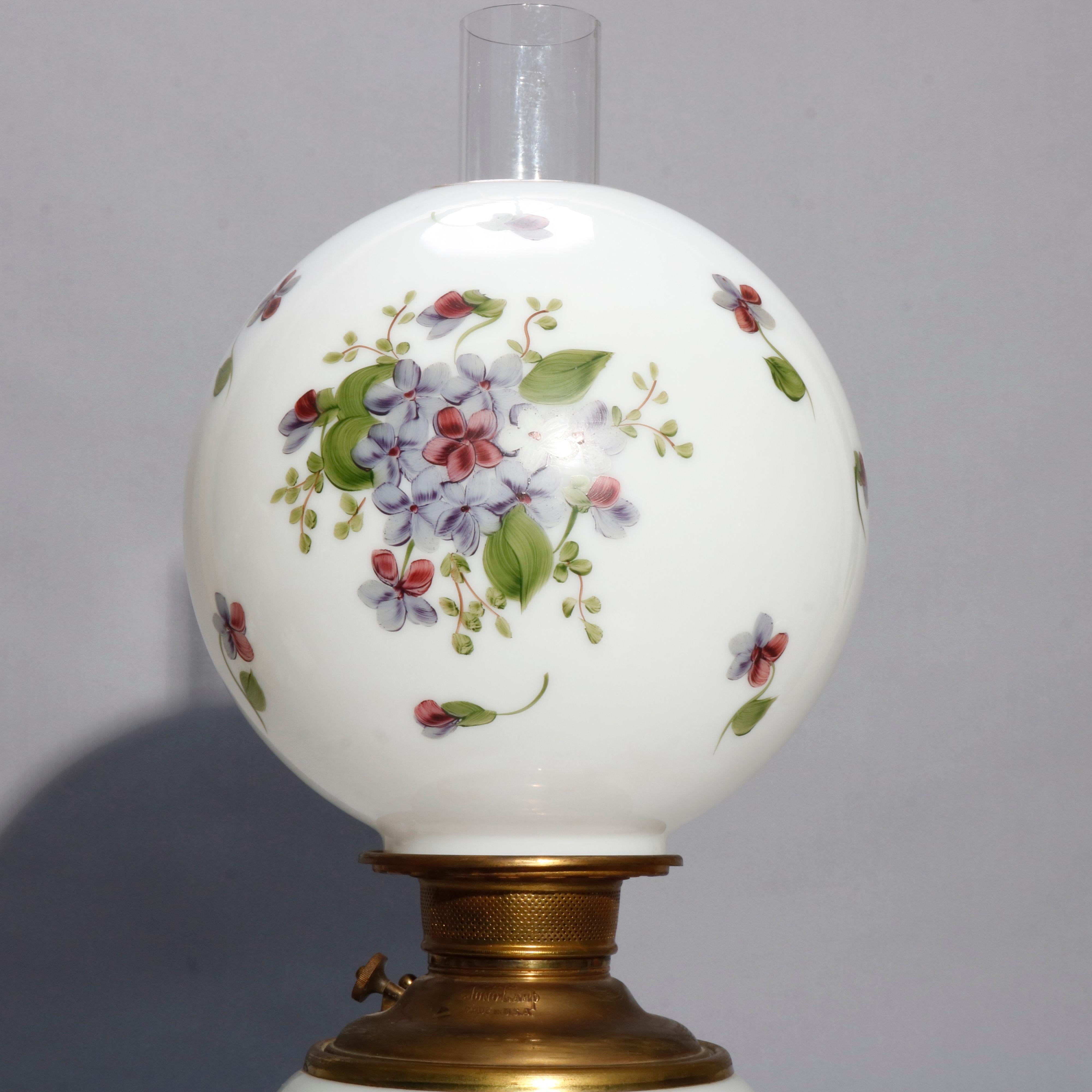 An antique Victorian Gone with The Wind table parlor lamp by Juno offers floral painted globe and base, signed as photographed, professionally rewired and working, 19th century.

Measures: 26.5