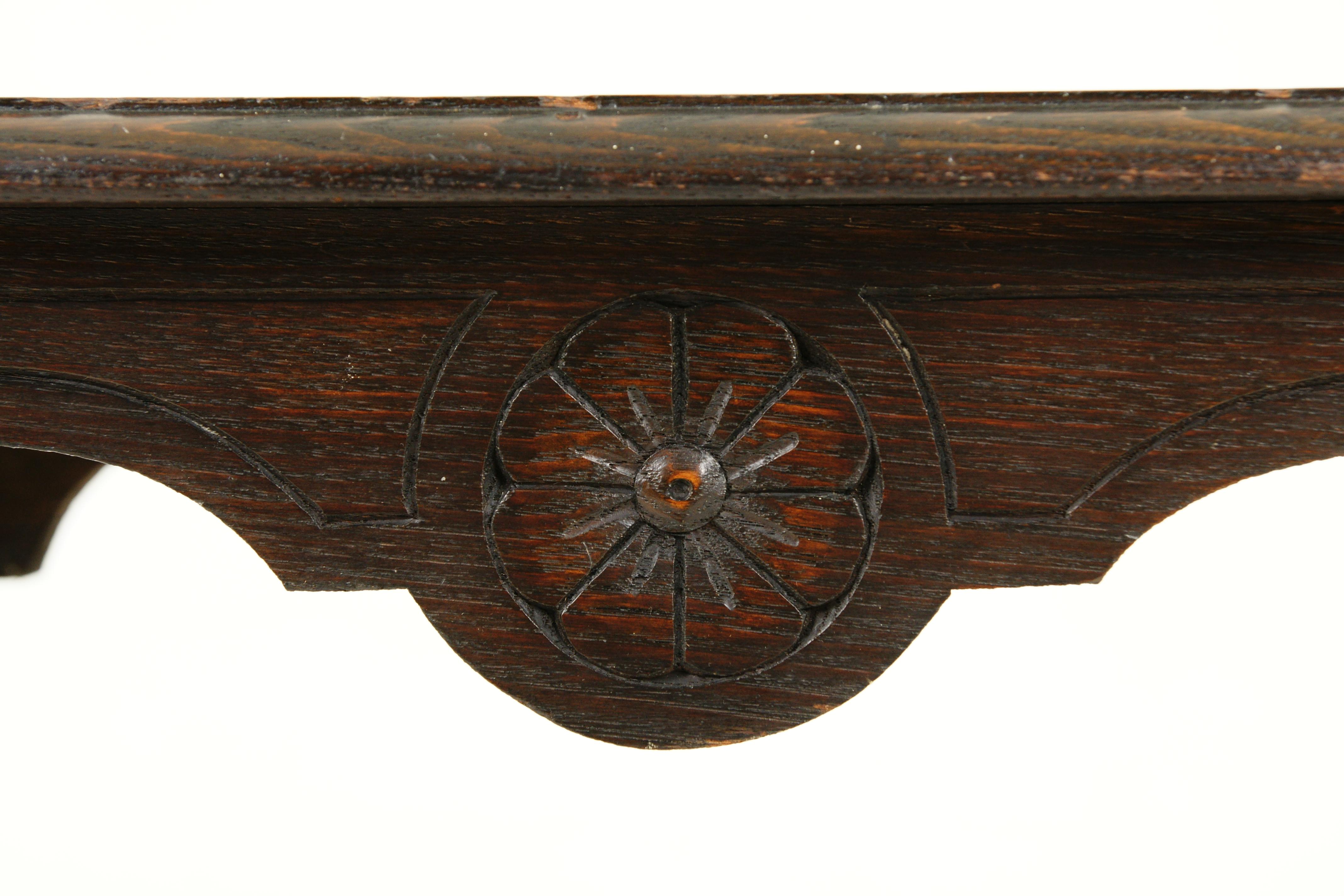 Antique Victorian gothic carved oak side table, lamp table, Scotland 1880, B2443

Scotland 1880
Solid oak
Original finish
Rectangular moulded top with carved border
The table has an arched, decorative and carved frieze
Standing on legs and