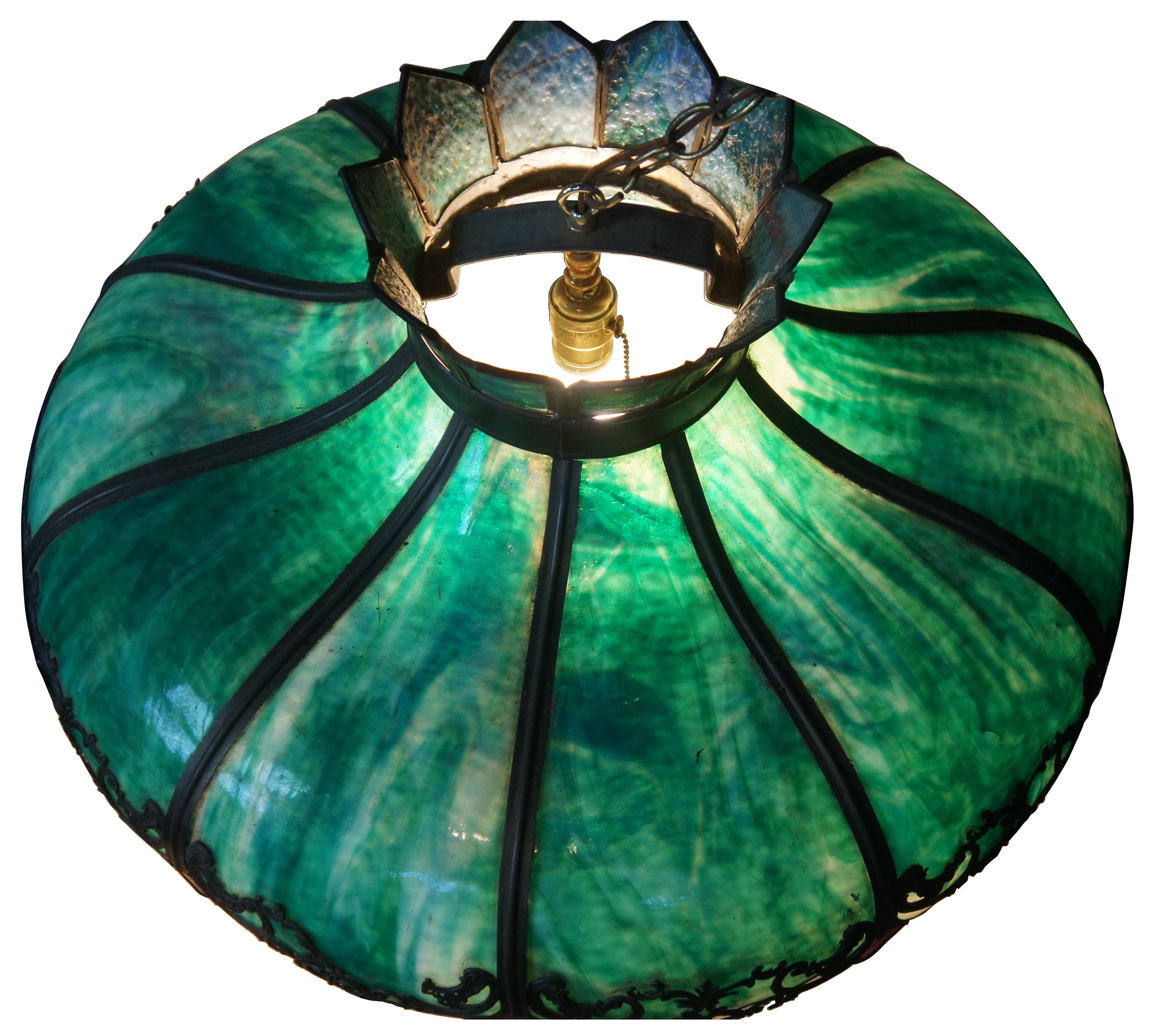Antique Victorian slag glass swag light or chandelier. Made with an iron and metal frame with scrolled accents over dramatic green slag glass accented with ruby red diamond tips. Measure: 23