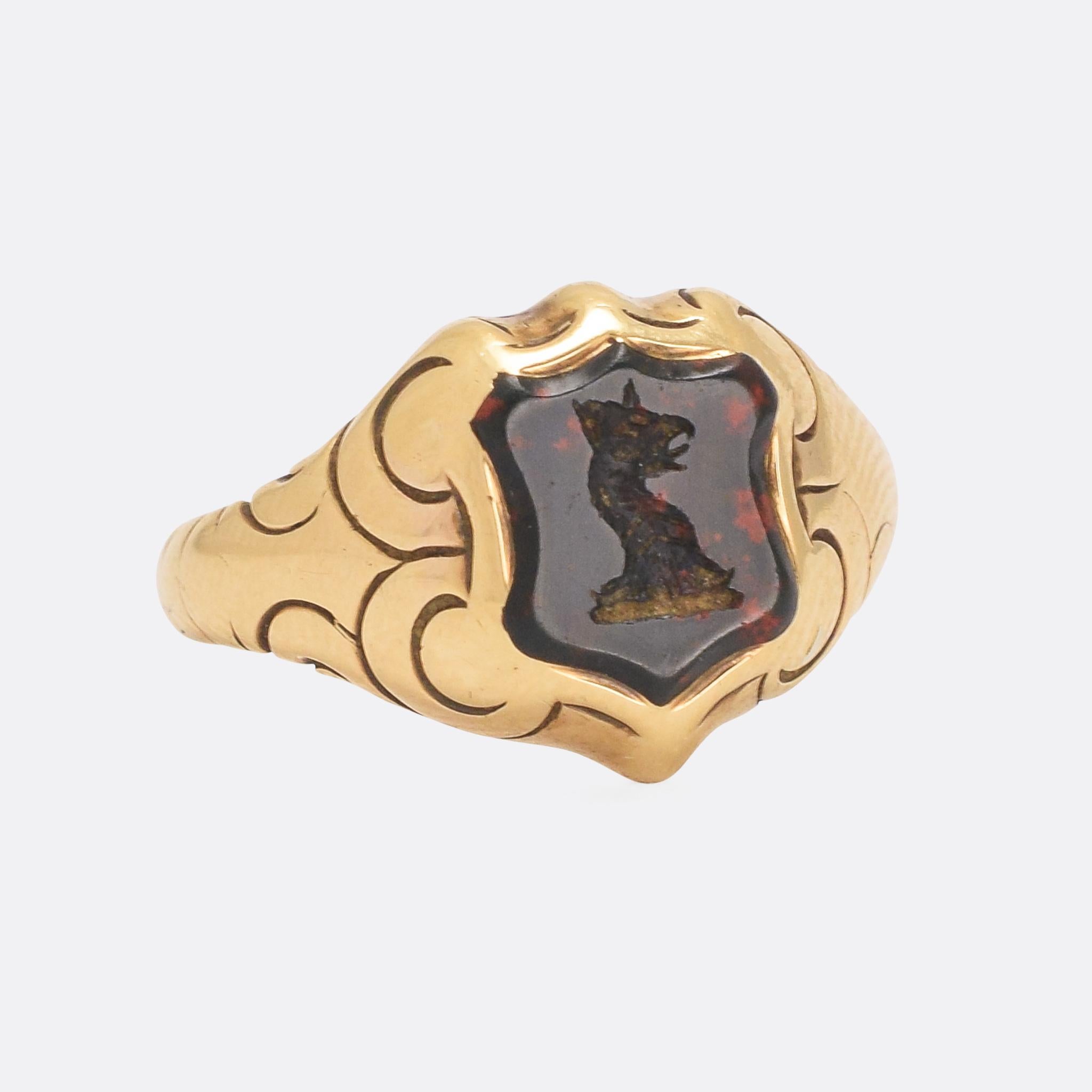 The coolest antique signet ring we've had in ages. The shield shape bloodstone crest shows impeccable colour - deep jet black with vivid flecks of blood red - and has been carved with an intaglio crest. The creature depicted is a Griffin; a