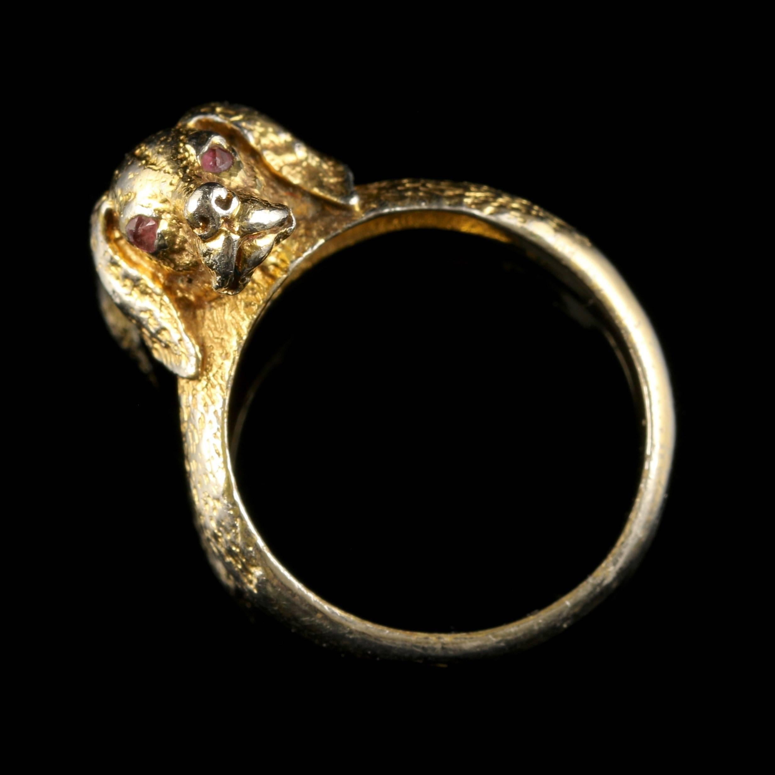 For more details please click continue reading down below...

This wonderful French ring is set with a little handsome Gun Dogs face, all set in Silver Gilt. Circa 1880

The dogs eyes are set with Garnet stones.

The Garnet is a stone of purity and