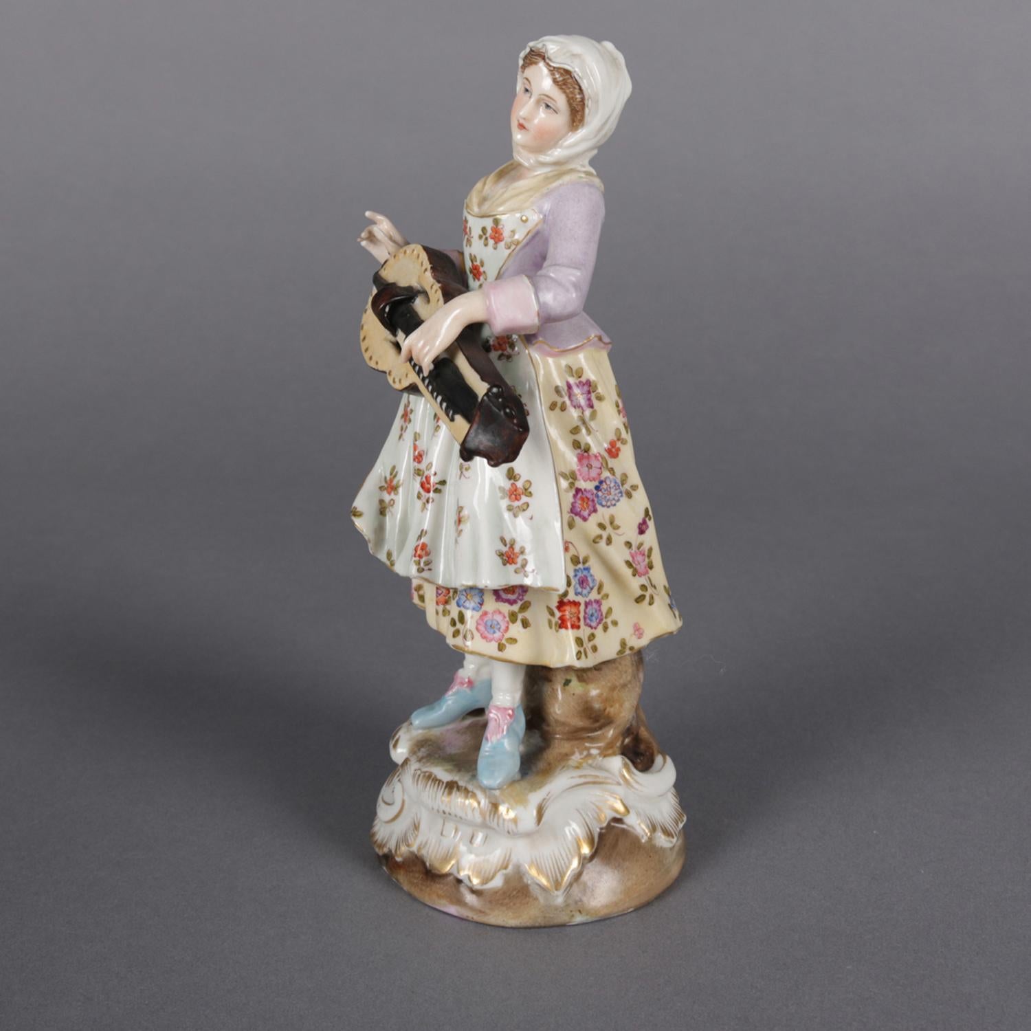 Antique Victorian Chelsea School porcelain figure of female musician features hand painted decoration with gilt highlights, marked on base as photographed, circa 1890.

Measures: 7