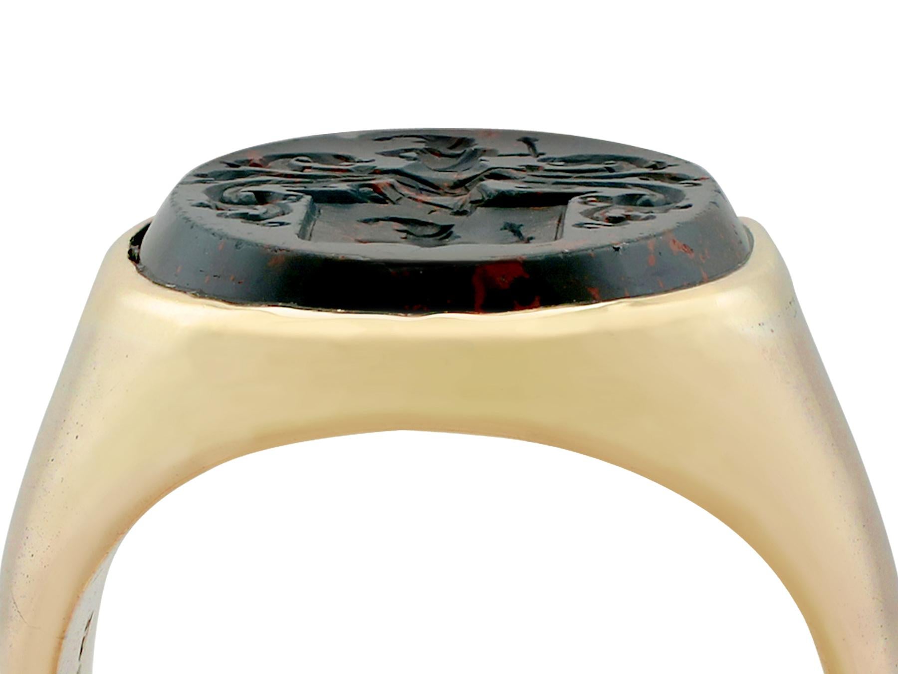 An impressive antique Victorian hardstone and 15 carat yellow gold intaglio signet ring; part of our diverse antique jewelry and estate jewelry collections.

This stunning, fine and impressive Victorian signet ring has been crafted in 15k yellow