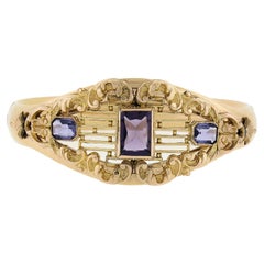 Antiguo brazalete victoriano pesado de oro con piedras moradas repulido con bisagra abierta