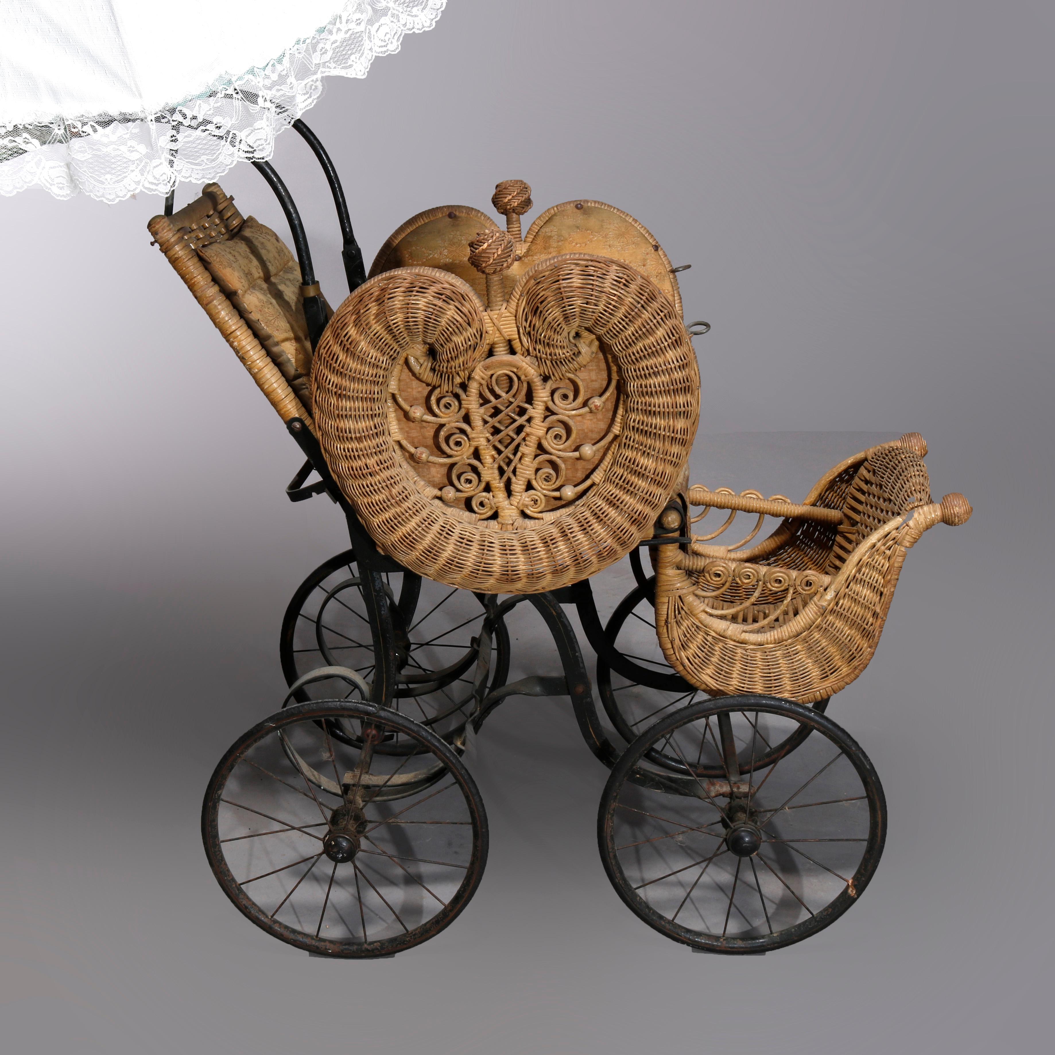 An antique Victorian baby buggy in the manner of Heywood Wakefield offers wicker construction with stylized heart form sides and parasol, c1890

Measures: 53