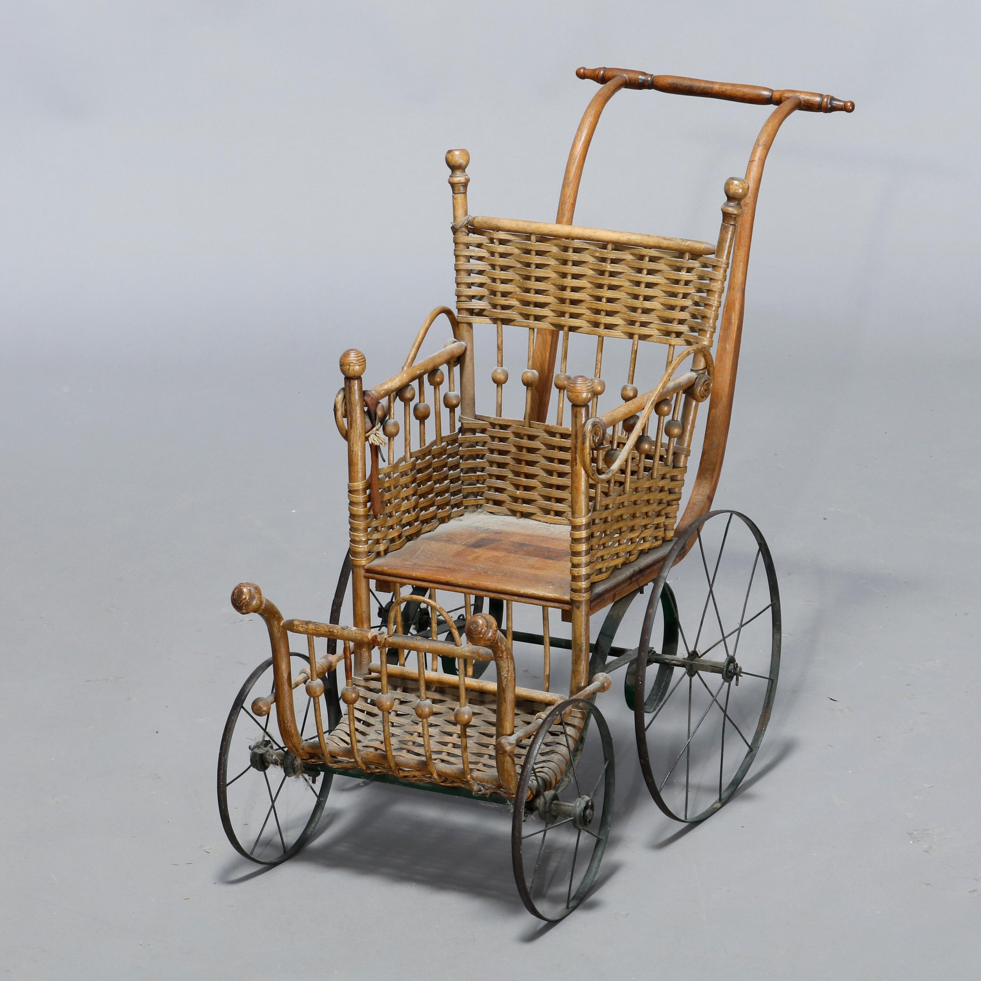 An antique Victorian baby doll buggy in the manner of Heywood Wakefield offers stick and ball wicker construction, circa 1890
 
Measures: 73
