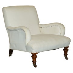 POLTRONA ANTICA DI STILE BRIDGEWATER DI HOWARD & Sons. Braccioli graziosamente scolpiti