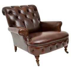 Antica poltrona vittoriana in pelle in stile Howard