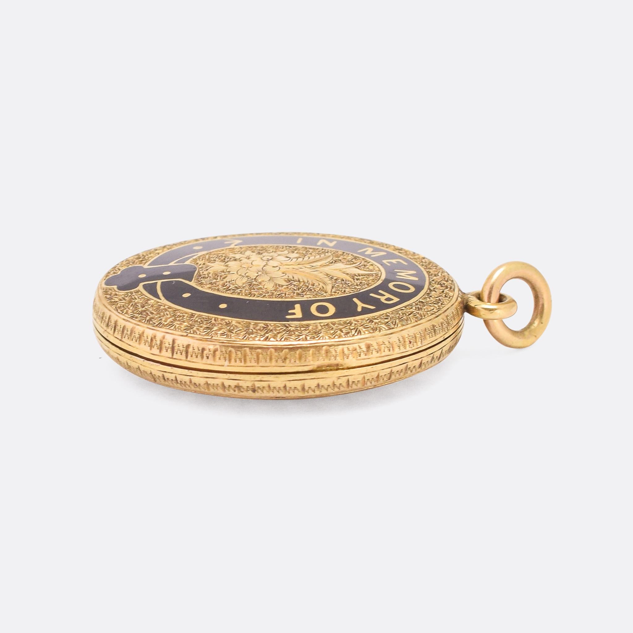 Beautiful Victorian IN MEMORY OF mourning locket dating from the latter half of the 19th Century, circa 1880. It's crafted in 15 karat gold and finished in black enamel that forms a buckle motif with the lettering within. The piece is intricately