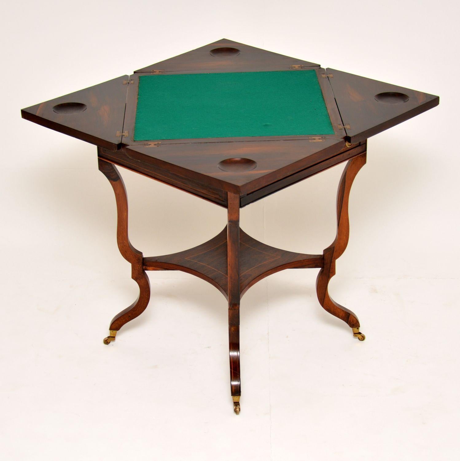 Nice quality antique Victorian ‘envelope card table’ in wood with some exquisite classical inlays on the top section. This card table is in good condition, having just been polished and I would date it to circa 1880s period. It’s a very clever