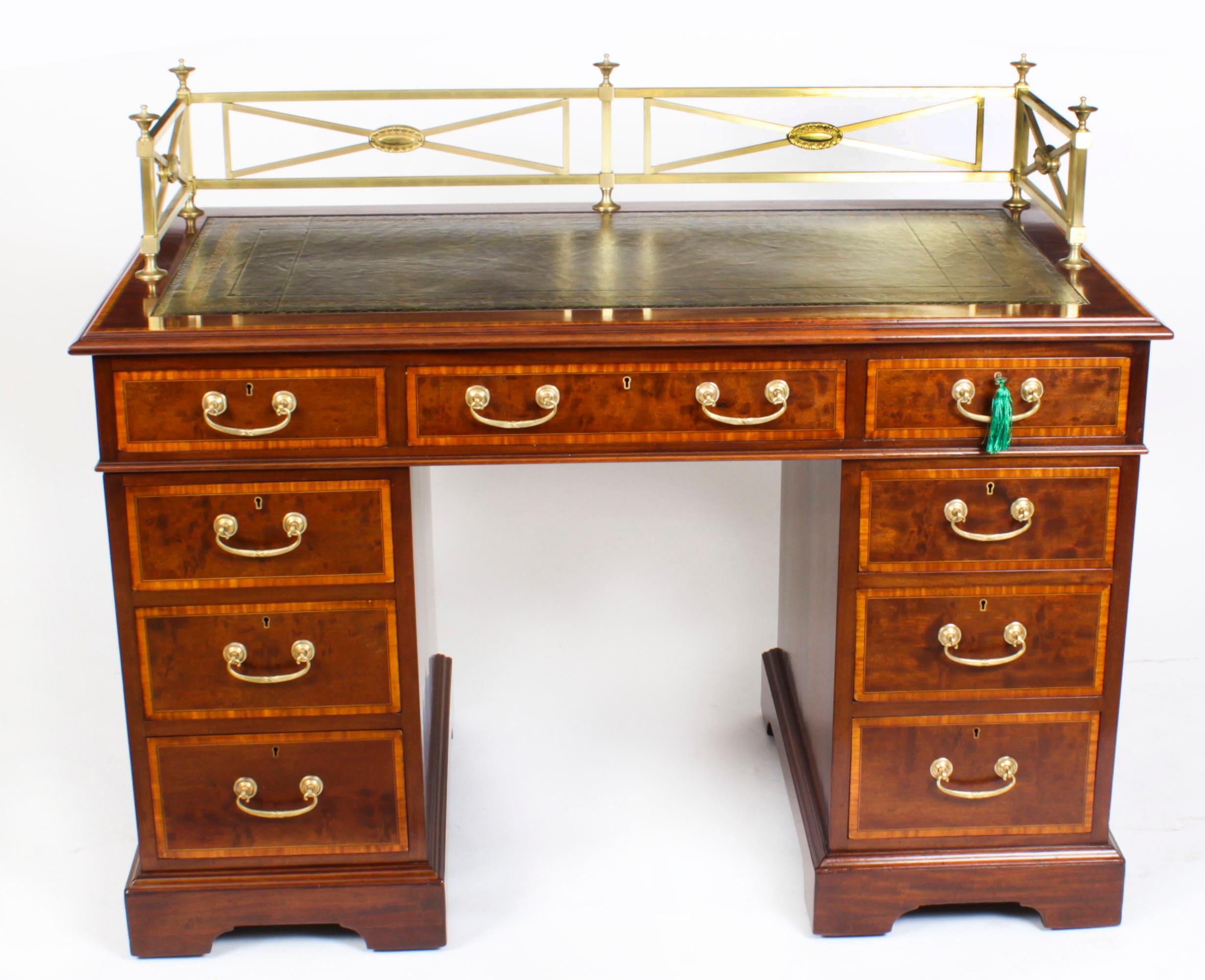 This is a superb antique Late Victorian Flame mahogany string inlaid and satinwood crossbanded pedestal kneehole desk, circa 1880 in date.
 
It is made from fabulous flame mahogany, the rectangular top with an inset olive green gold tooled leather