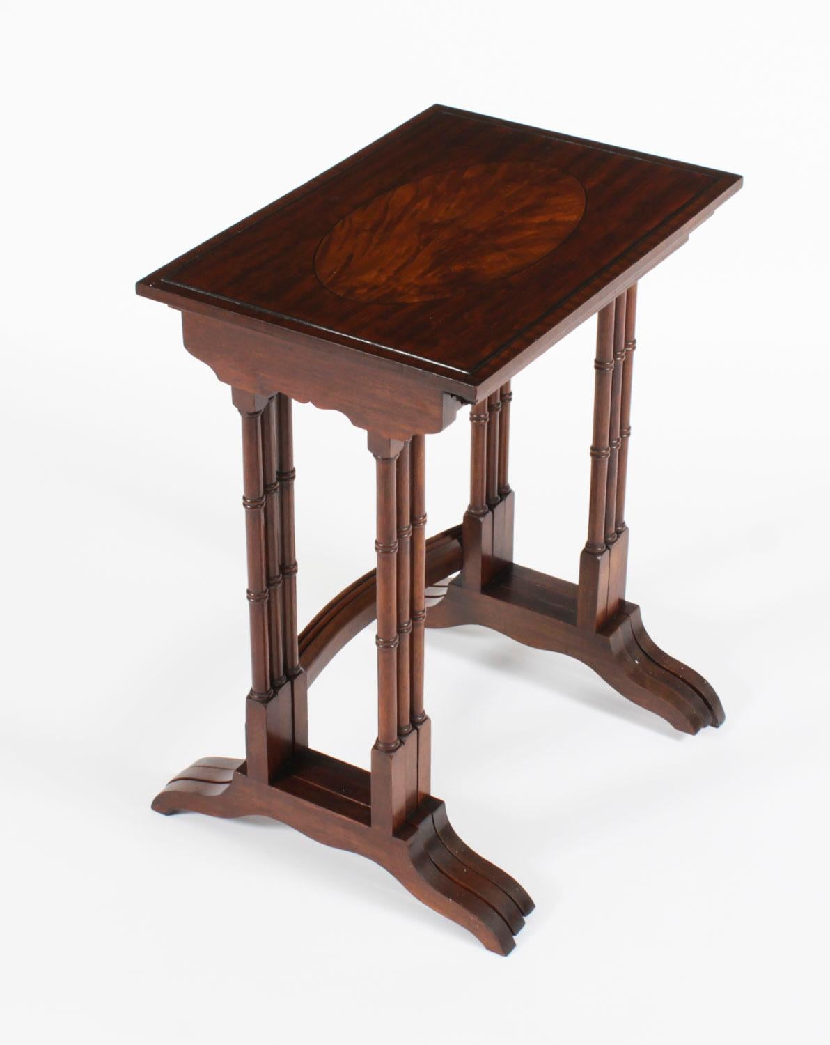 This is a beautiful antique Victorian flame mahogany and inlay nest of tables, circa 1880 in date. 

The nest consists of a set of three matching interlocking tables, each has a rich oval flame mahogany panel surrounded by ebony stringing. They are