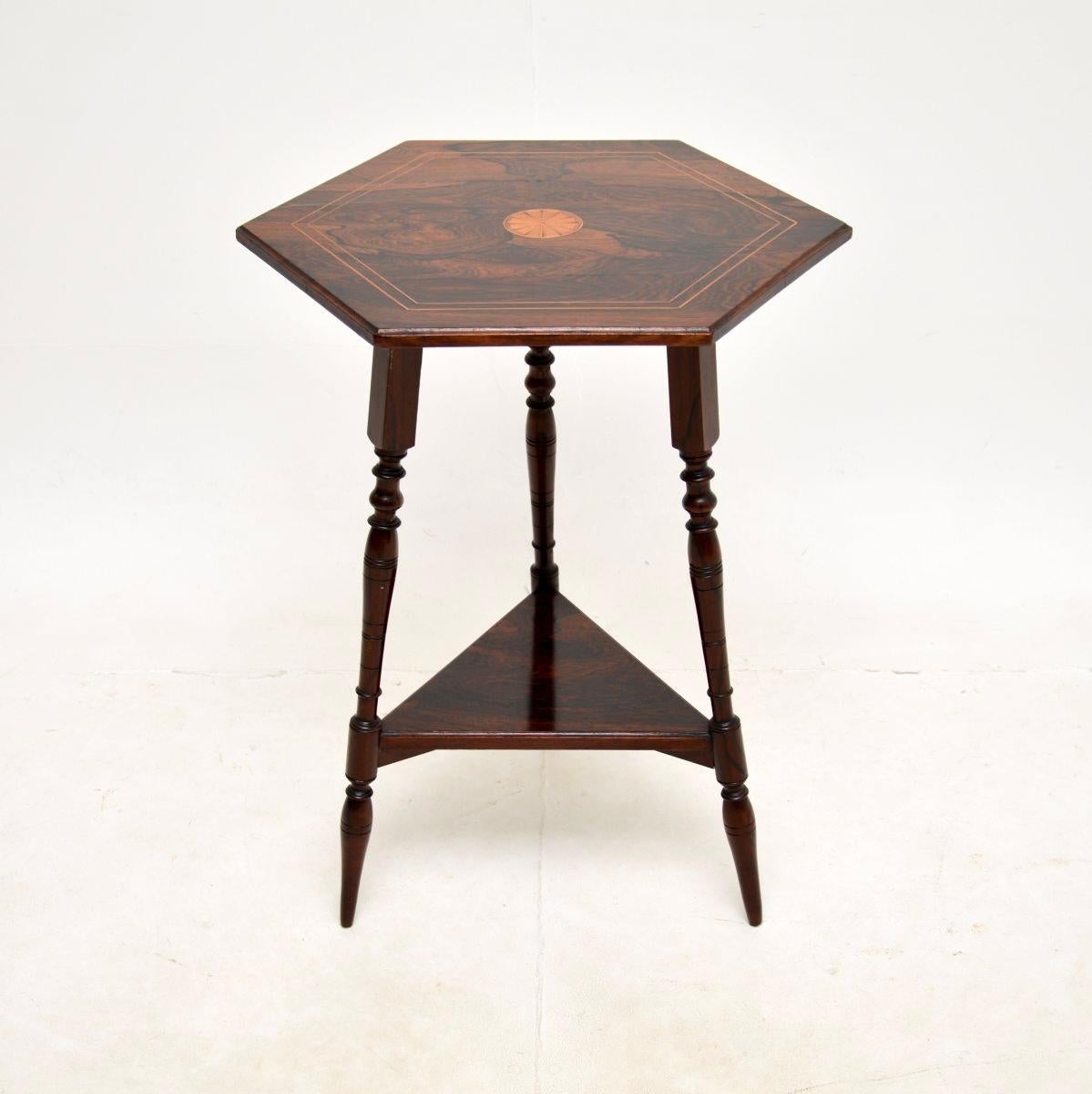 A lovely antique Victorian inlaid side table. This was made in England, it dates from around the 1890-1900 period.

It is of extremely fine quality and is a very useful size. The three legs are beautifully turned, they support an octagonal top which