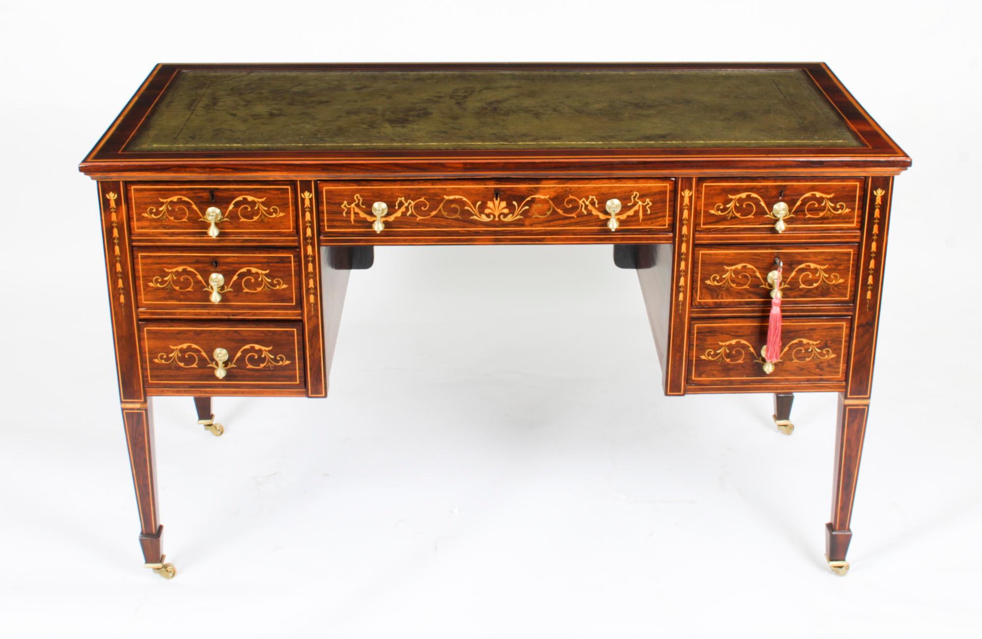 This is a lovely late Vicorian Gonçalo Alves and Marquetry writing table / desk, Circa 1880 in date and in the manner of Edwards & Roberts.

The rectangular top has a moulded edge and features satinwood banding with an inset gold tooled green