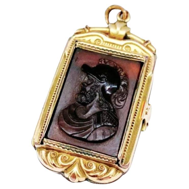 Antique victorian intigalio large locket pendant with engraved hard stone made of 10k gold with total weight of 10.60 grams and 4cm lenght in detailed gold workmanship dates back to 1880.c victorian era
